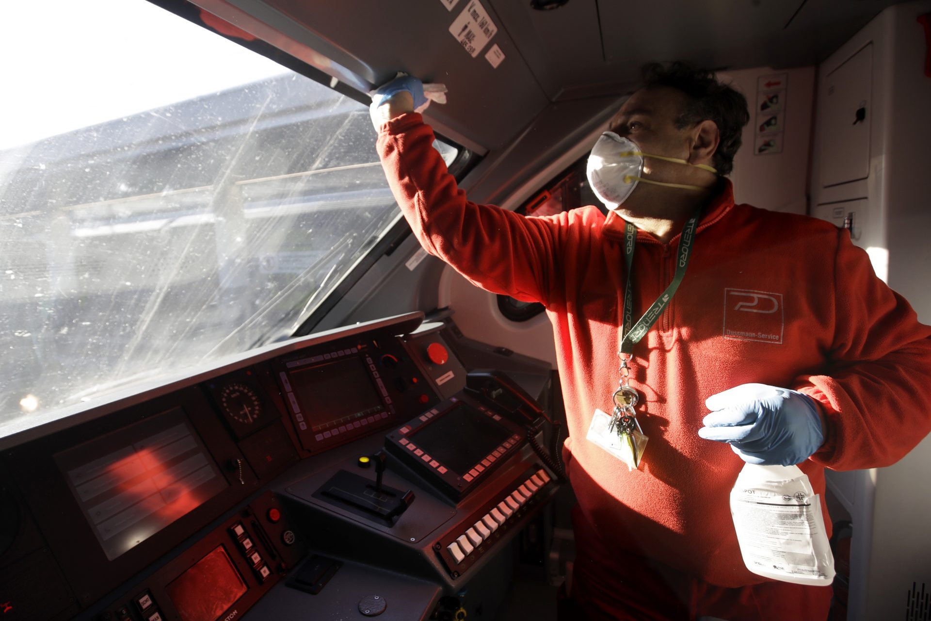 A cleaner sanitizes the cockpit of a regional train, at the Garibaldi train station in Milan, Italy, Friday, Feb. 28, 2020. Authorities are taking new measures to sanitize trains and public transportation after the COVID-19 virus outbreak.