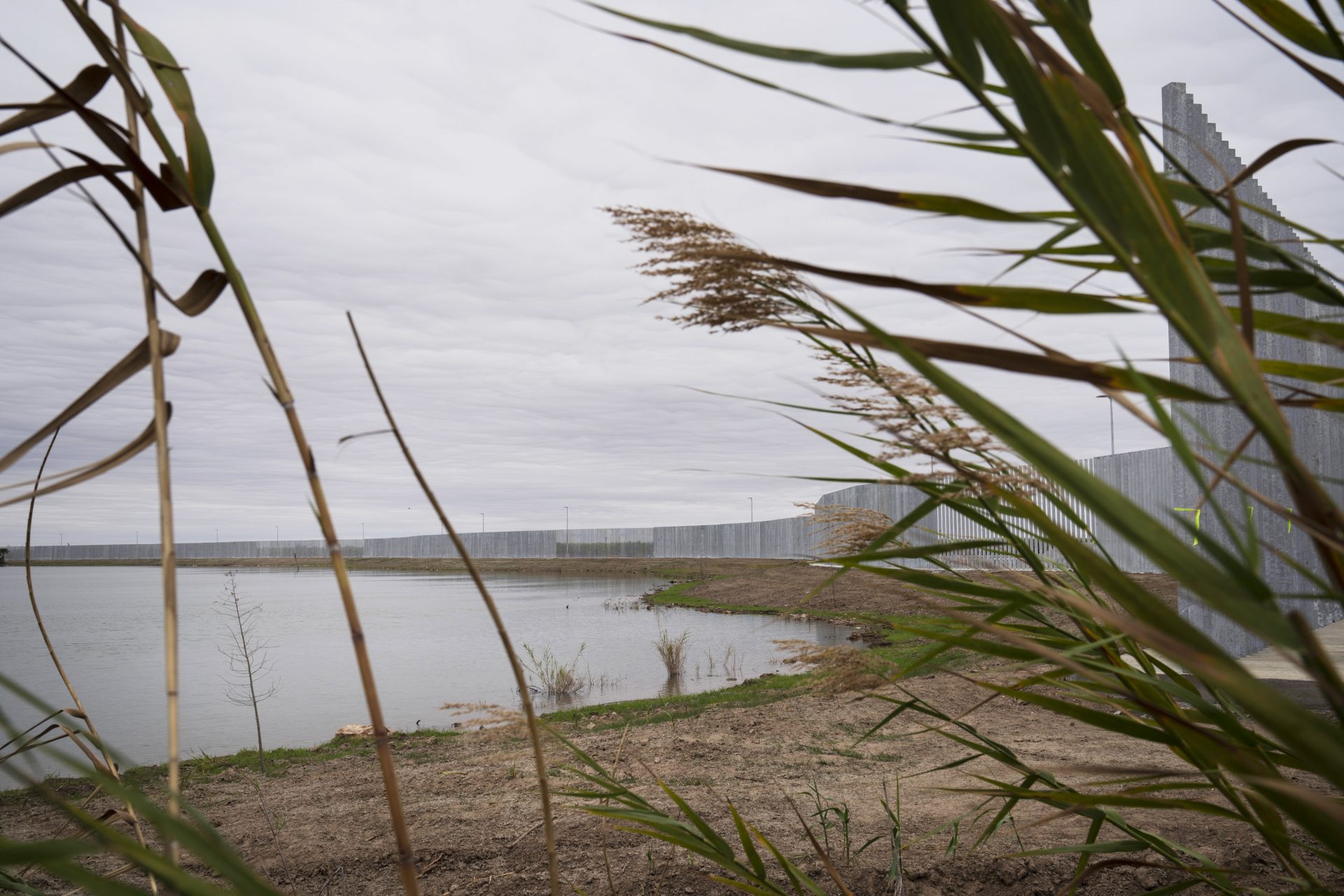 The privately funded border wall built on private land can be seen from Fred Cavazos’ property in front of the Rio Grande.