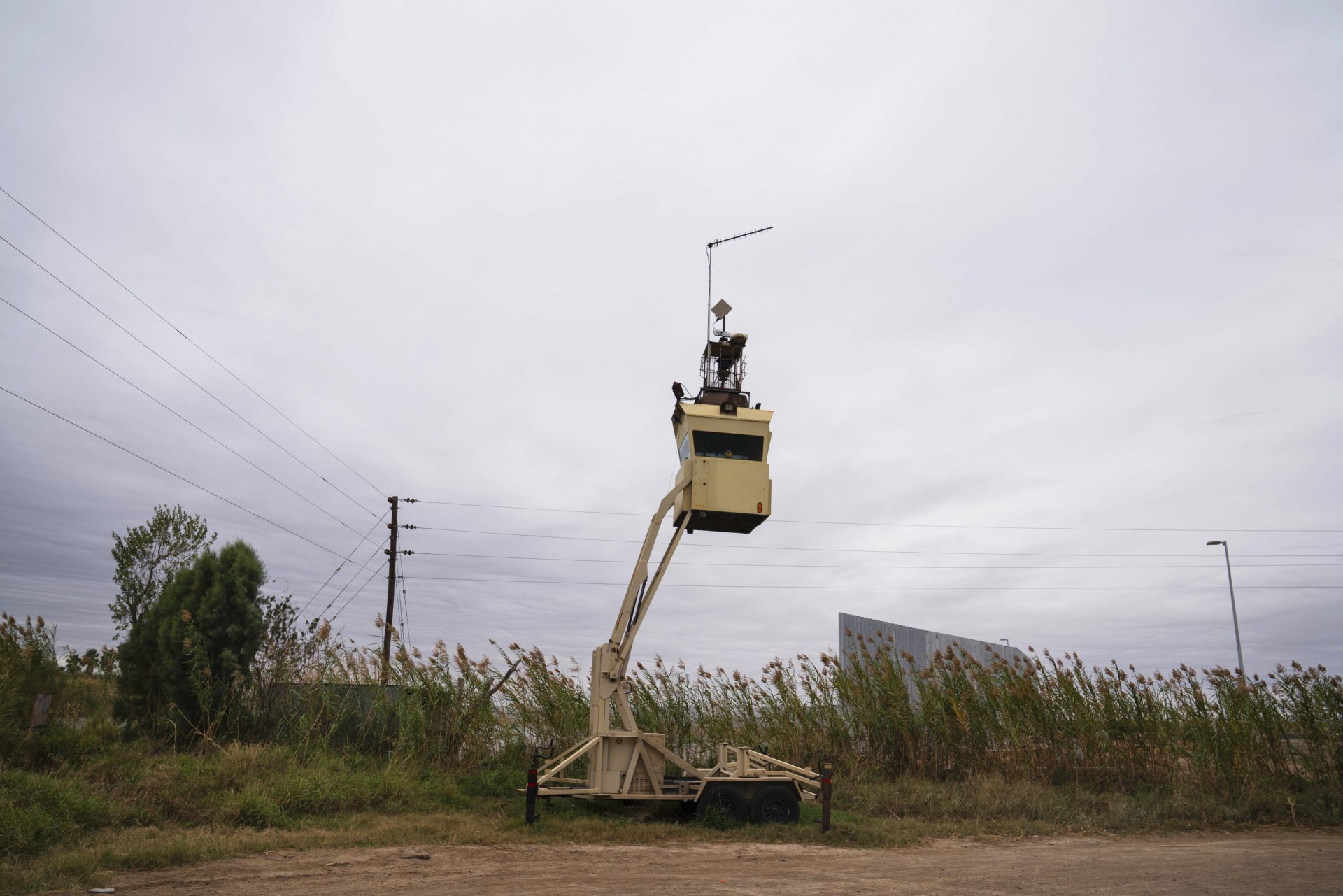 A surveillance tower is seen in Fred Cavazos' property yards away from the Rio Grande and the privately funded border wall in Mission, Texas.