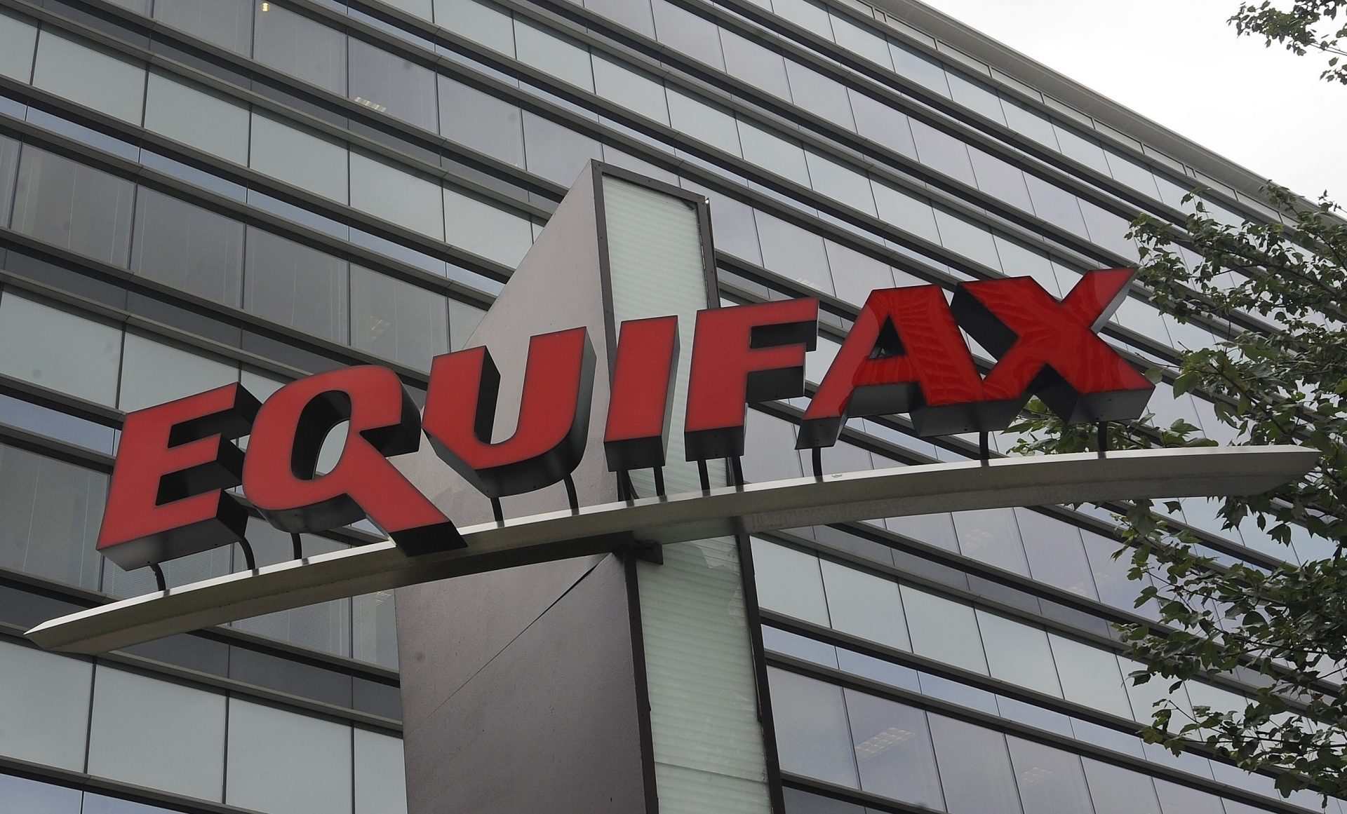 FILE- This July 21, 2012, file photo shows signage at the corporate headquarters of Equifax Inc. in Atlanta. The FTC on Wednesday, July 31, 2019, told consumers affected by the Equifax data breach that they are unlikely to get the full $125 cash payment that many sought.