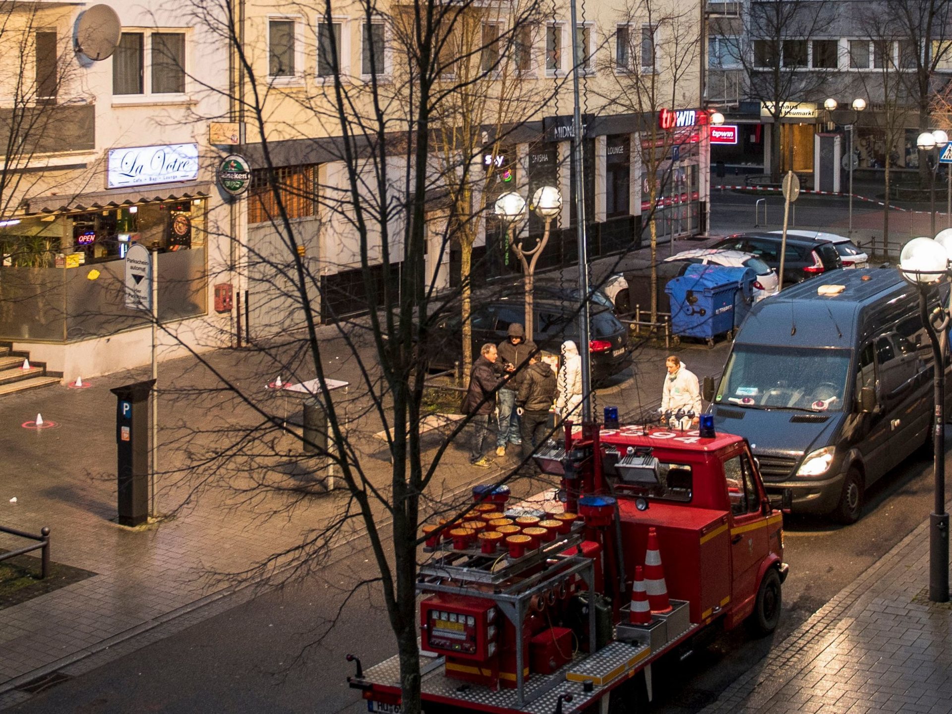 Forensic police work at a crime scene in front of a bar and hookah lounge at the Heumarkt in downtown Hanau, near Frankfurt, on Thursday.