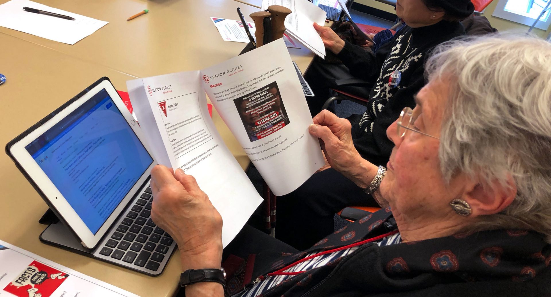 Marlene Cianci looks at a meme about the census. The workshop helps seniors parse the source of an article, fact-check a claim online and discern propaganda from reputable sources.