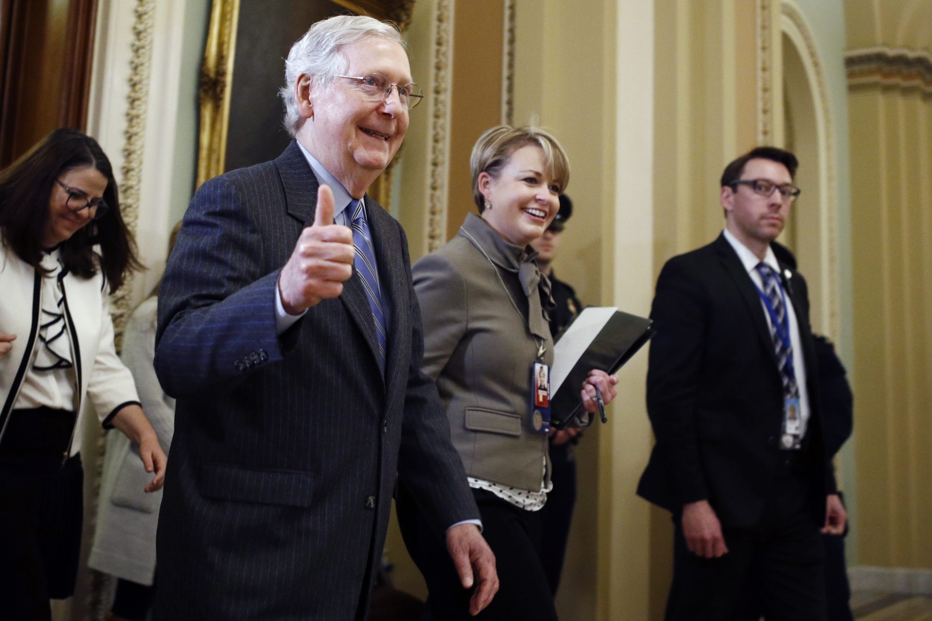 Senate Majority Leader Mitch McConnell, R-Ky., gives a thumbs-up as he leaves the Senate chamber during the impeachment trial of President Donald Trump at the Capitol, Friday, Jan. 31, 2020, in Washington.