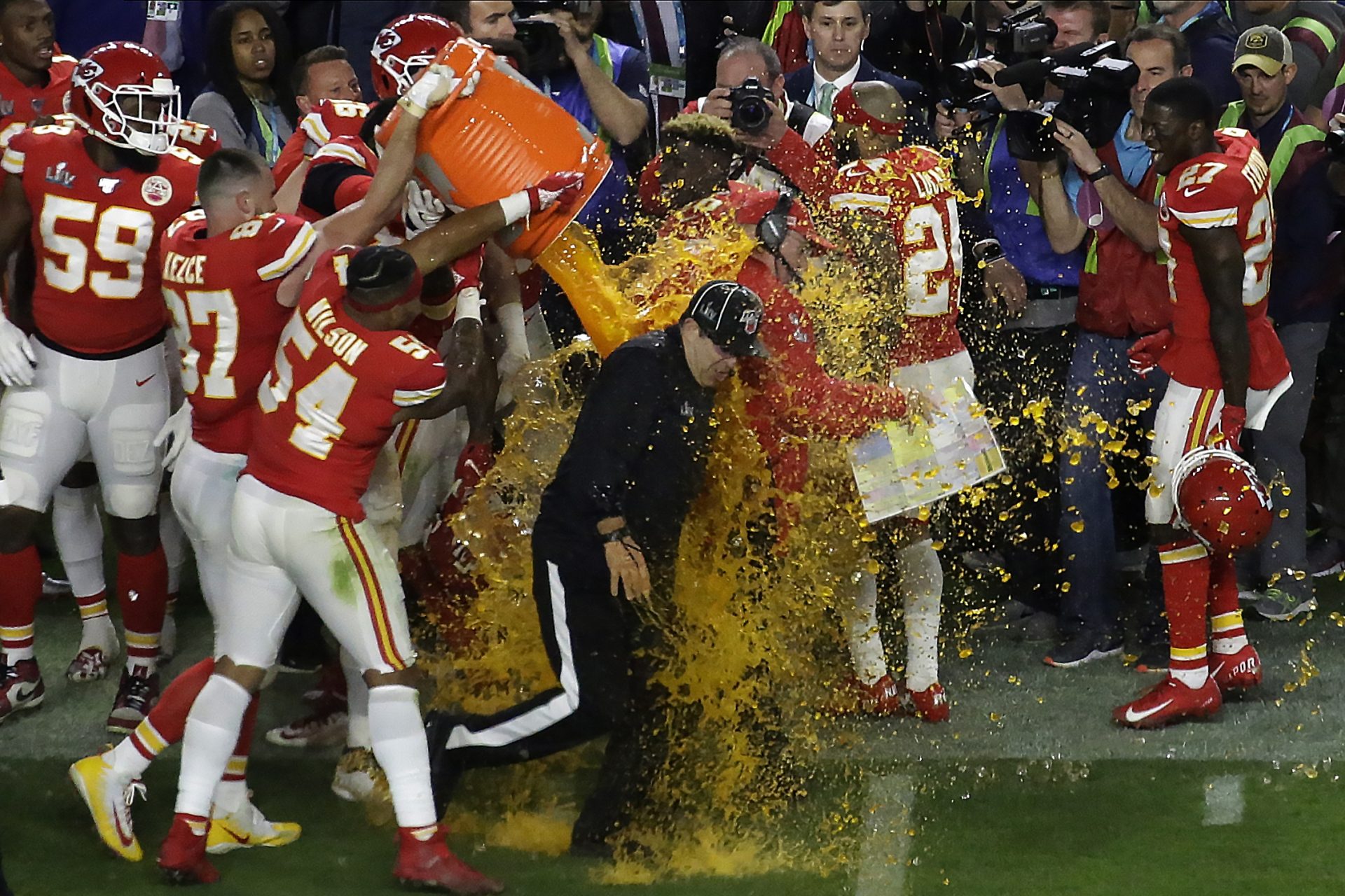 Kansan City Chiefs' players pour a cooler of Gatorade on head coach Andy Reid and members of the coaching staff, after winning the NFL Super Bowl 54 football game Sunday, Feb. 2, 2020, in Miami Gardens, Fla. The Chiefs' defeated the San Francisco 49ers 31-20.