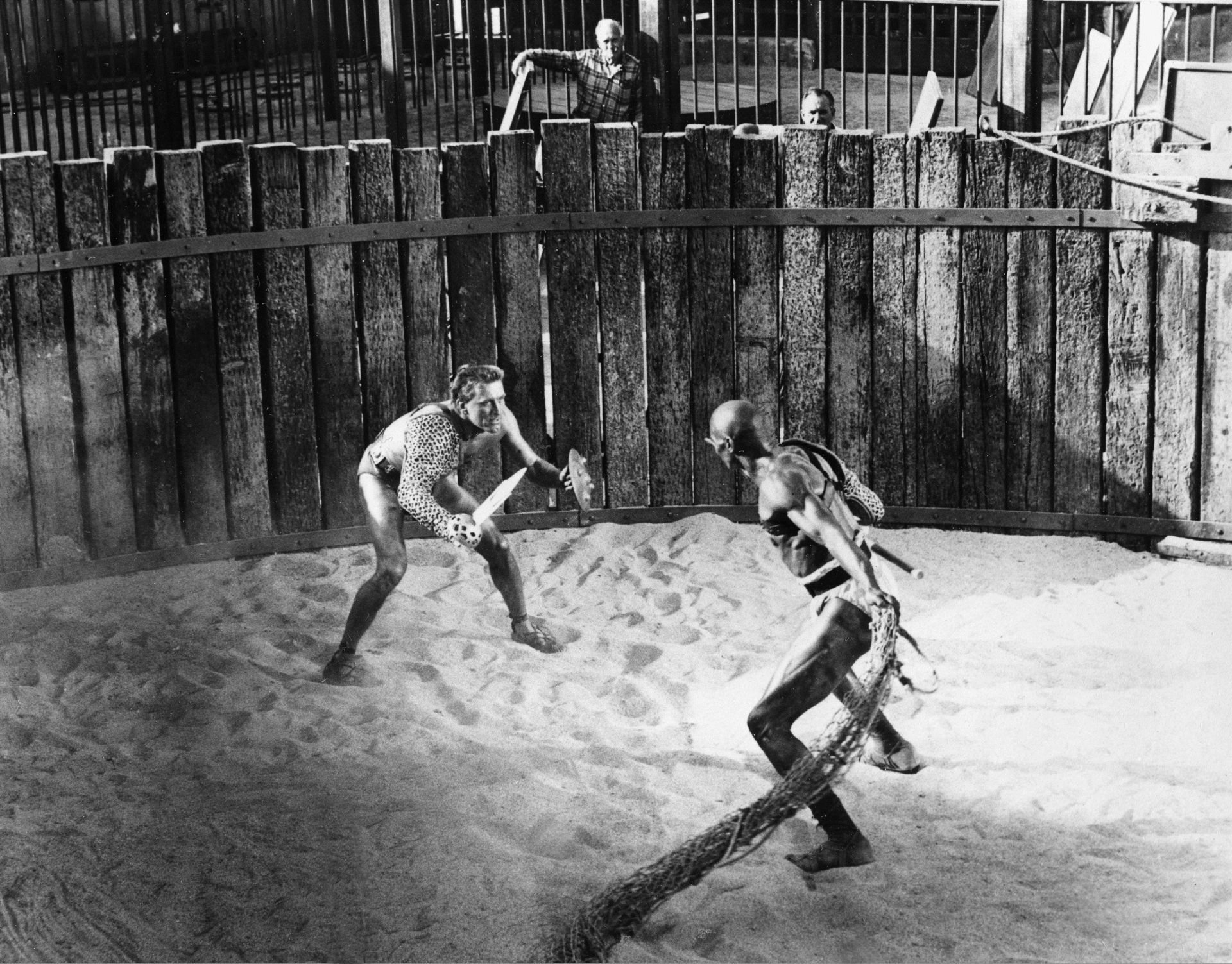 FILE - In this April 1959 file photo, actor Kirk Douglas, left, in the title role as a Roman slave and gladiator, Spartacus, battles Woody Strode in the role of gladiator Draba in a scene from "Spartacus" filmed in Hollywood, Ca. A new South African production of the ballet, "A Spartacus in Africa," will incorporate African dance styles with classical and contemporary dance for a story that its producers say resonates on a continent with its own history of oppression.