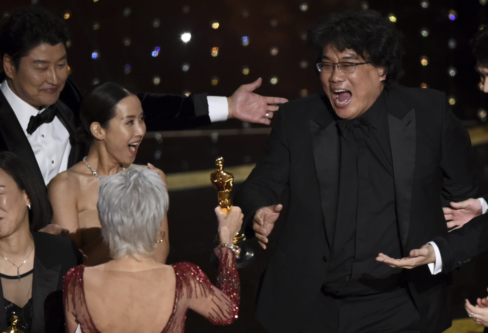 Bong Joon Ho, right, reacts as he is presented with the award for best picture for 