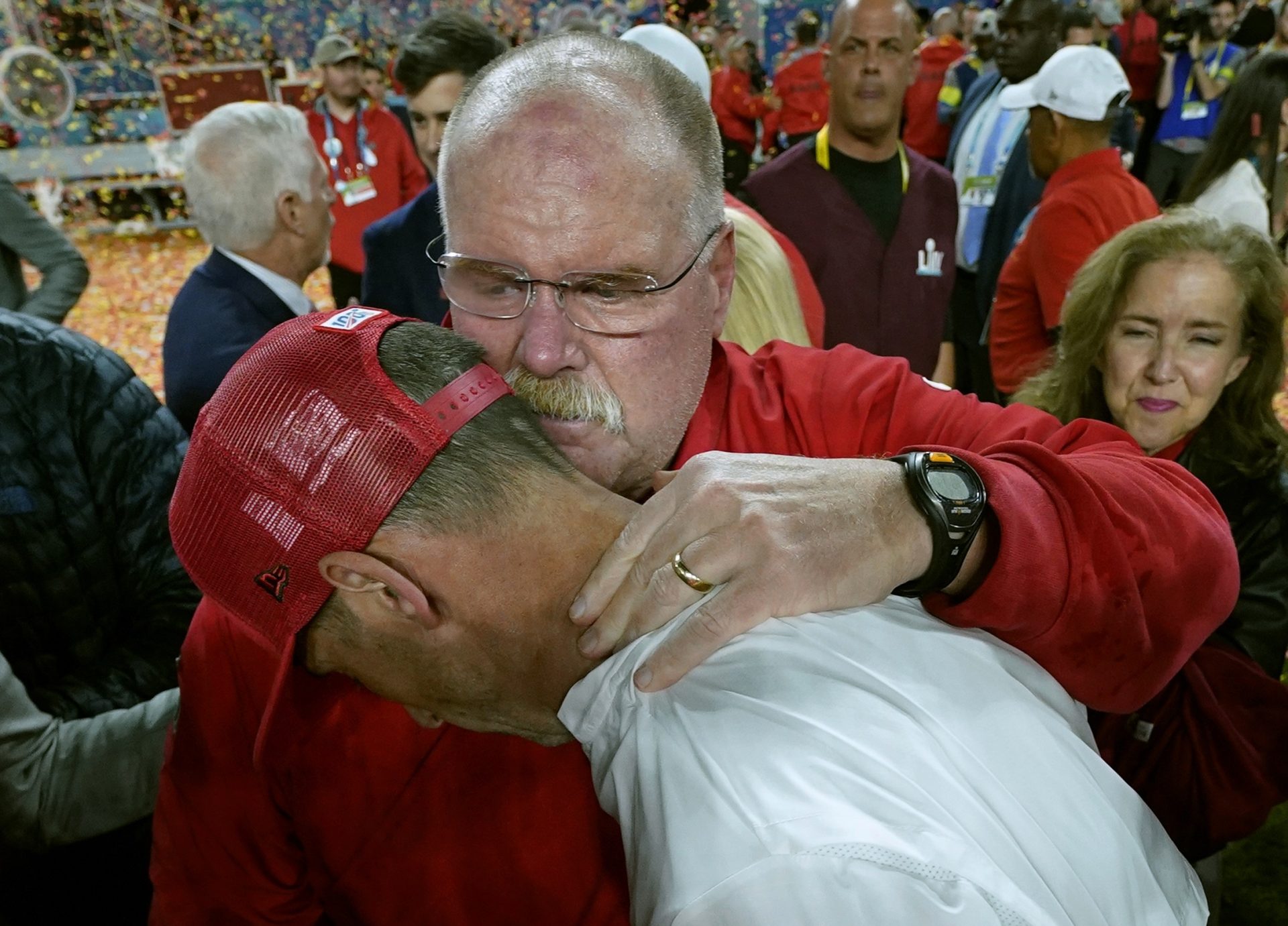 Kansas City Chiefs head coach Andy Reid, rear, puts his arm around San Francisco 49ers head coach Kyle Shanahan after the Chiefs defeated the 49ers in the NFL Super Bowl 54 football game Sunday, Feb. 2, 2020, in Miami Gardens, Fla.