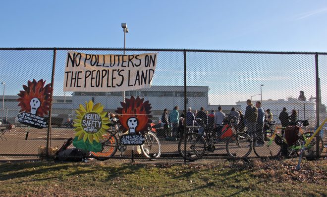 Protesters gather in a parking lot at the Philadelphia Energy Solutions refinery office on Passayunk Avenue in South Philadelphia. Activists from Philly Thrive and POWER Philadelphia want to prevent a restart of the refinery, which was closed after an explosion and fire in June 2019. 