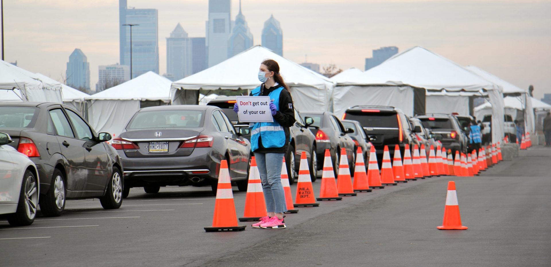 Cars line up at a drive through coronavirus test station in the parking lot at Citizens Bank Park.