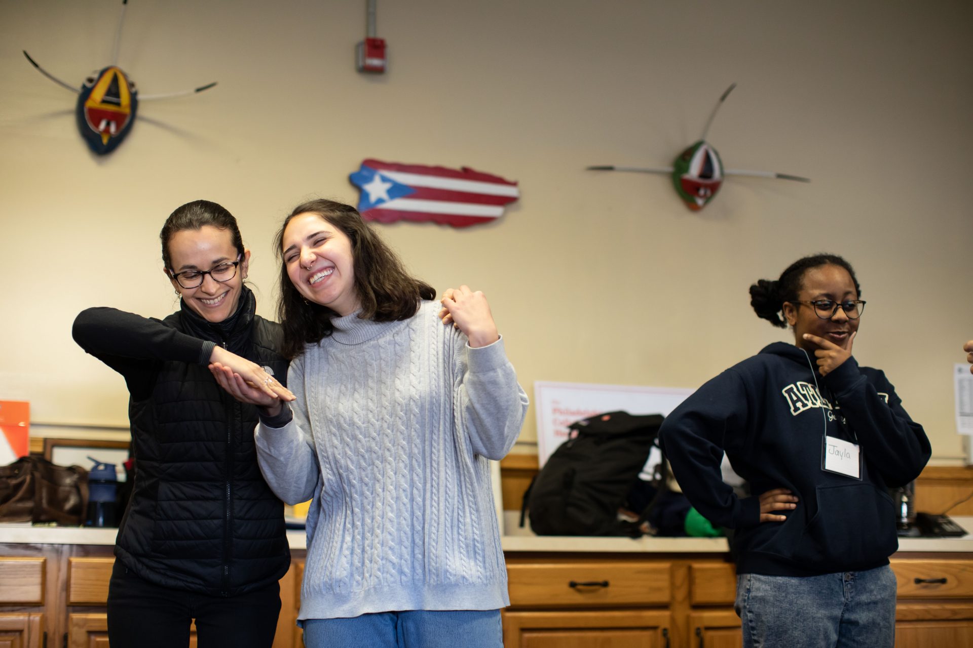 Andria Bibiloni and Laura Beery (left) participate in a warm-up exercise during rehearsal for the play "Count Me In," a forum theater project meant to encourage participation in the 2020 census among immigrant communities.