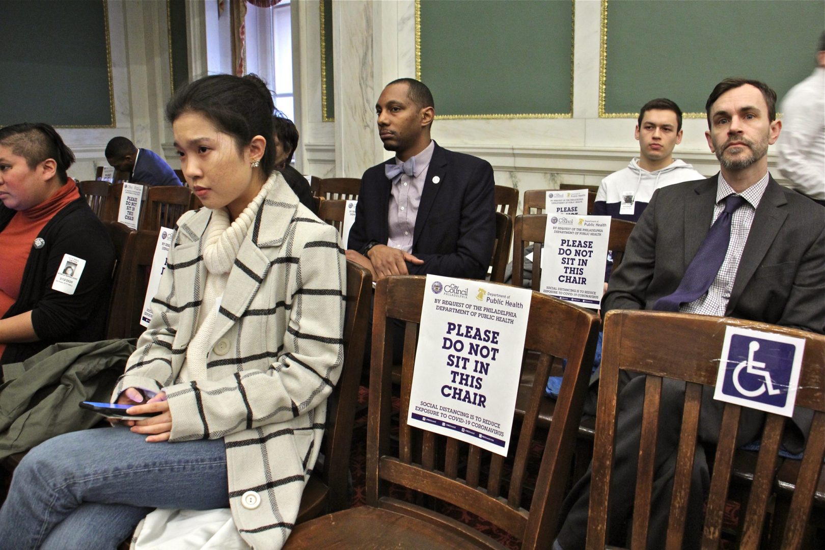 At Philadelphia City Council meeting, attendees were tod to use every other chair to reduce the chances of exposure to coronavirus. (Emma Lee/WHYY)