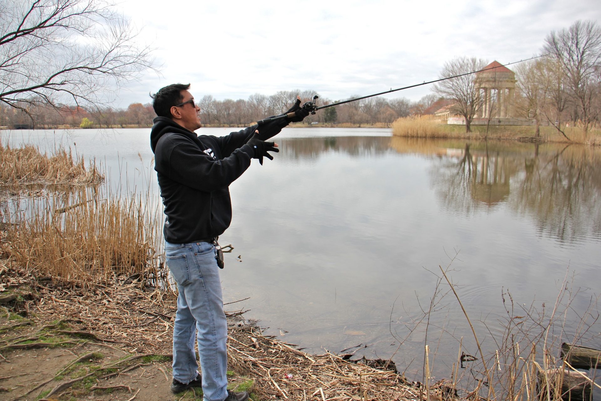 Tony Yoon fishes at Meadow Lake in FDR Park.