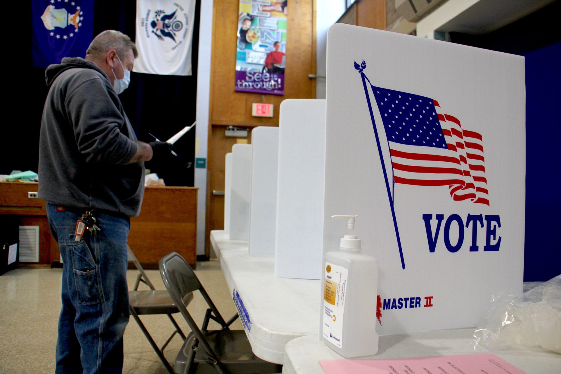 Bob Russikoff wears a mask and gloves to vote in the special election for Pennsylvania House of Representatives in Bensalem. Russikoff voted at Cecelia Snyder Middle School, where poll workers said turnout was low, but better than expected under the circumstances.