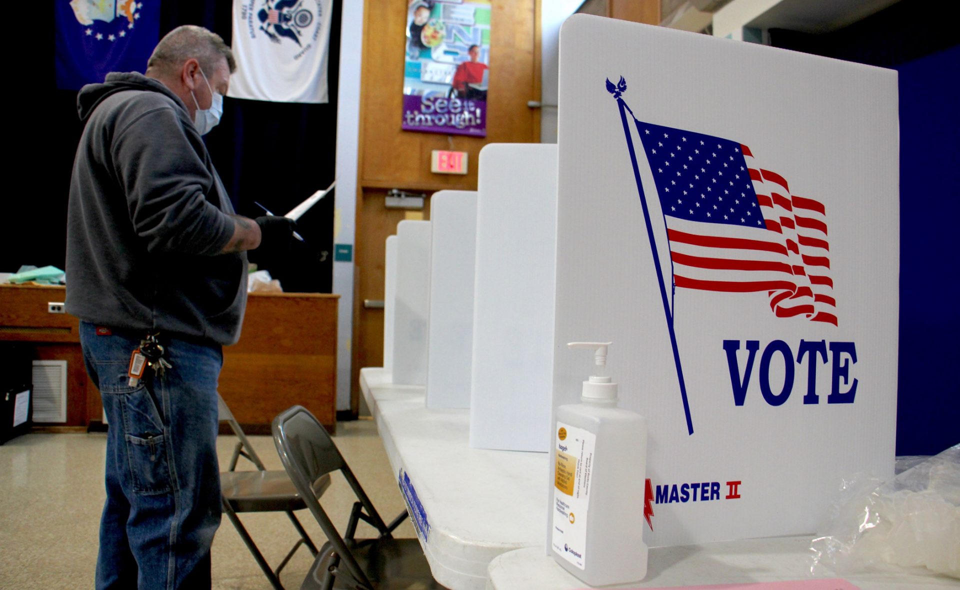 Bob Russikoff wears a mask and gloves to vote in the special election for Pennsylvania House of Representatives in Bensalem. Russikoff voted at Cecelia Snyder Middle School, where poll workers said turnout was low, but better than expected under the circumstances.