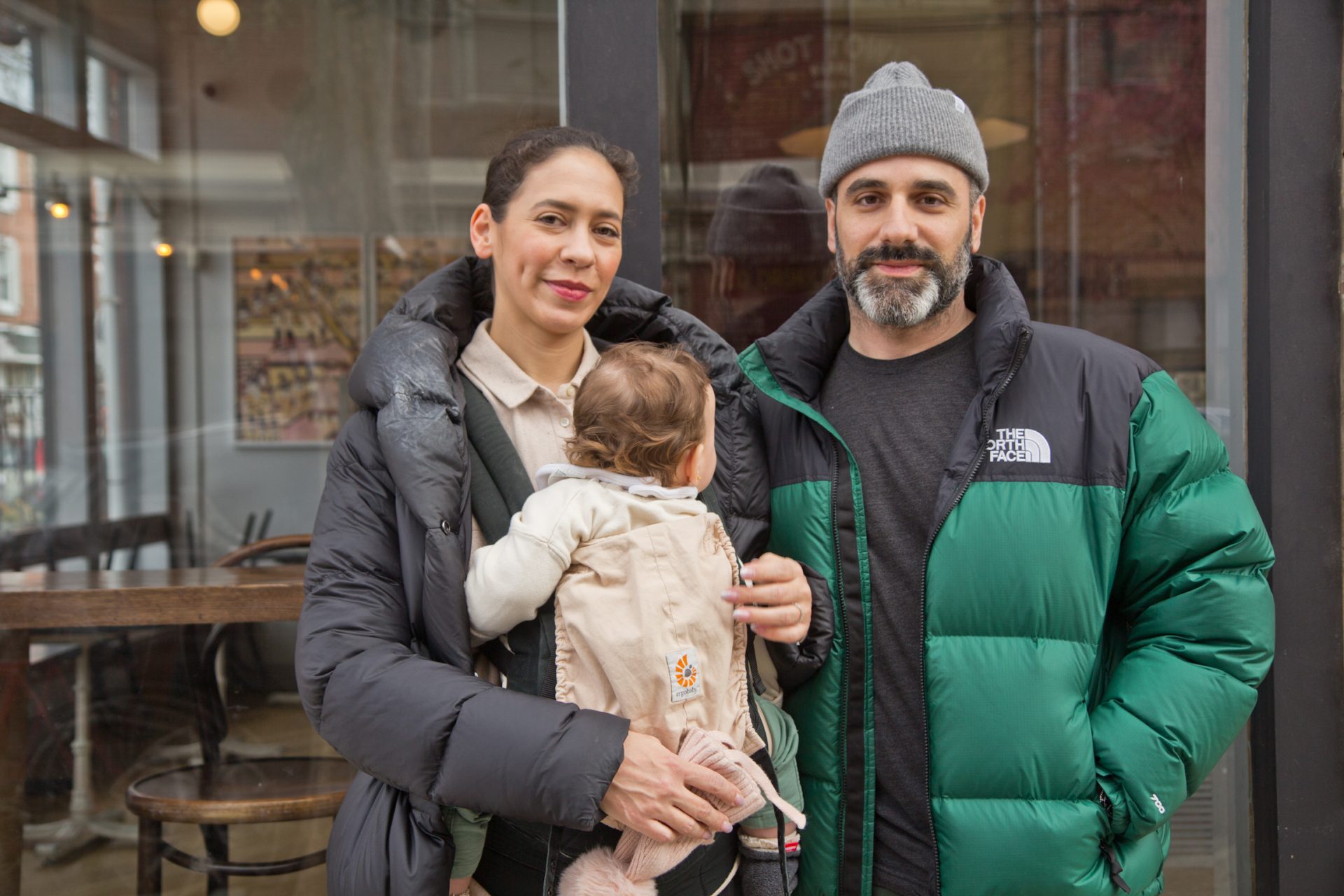 Mariel Freeman, the owner of Shot Tower coffee house, her husband Matthew Derago and her 9th month-old baby Gigi.