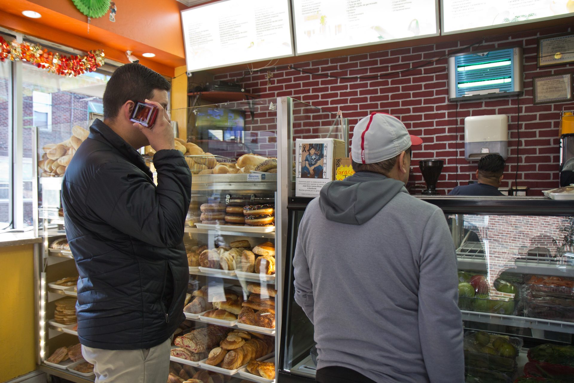 Customers stand in line in Rosa’s bakery in South Philadelphia. 