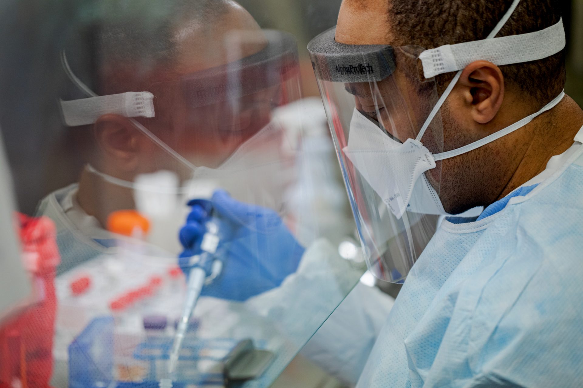 Pennsylvania Commonwealth microbiologist Kerry Pollard performs a manual extraction of the coronavirus inside the extraction lab at the Pennsylvania Department of Health Bureau of Laboratories on Friday, March 6, 2020.