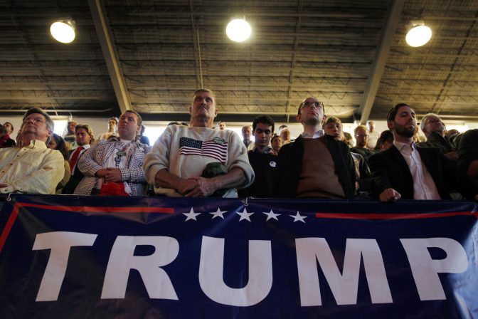 People pause in prayer during a campaign rally for Republican presidential candidate Donald Trump Nov. 7, 2016, in Scranton, Pa.