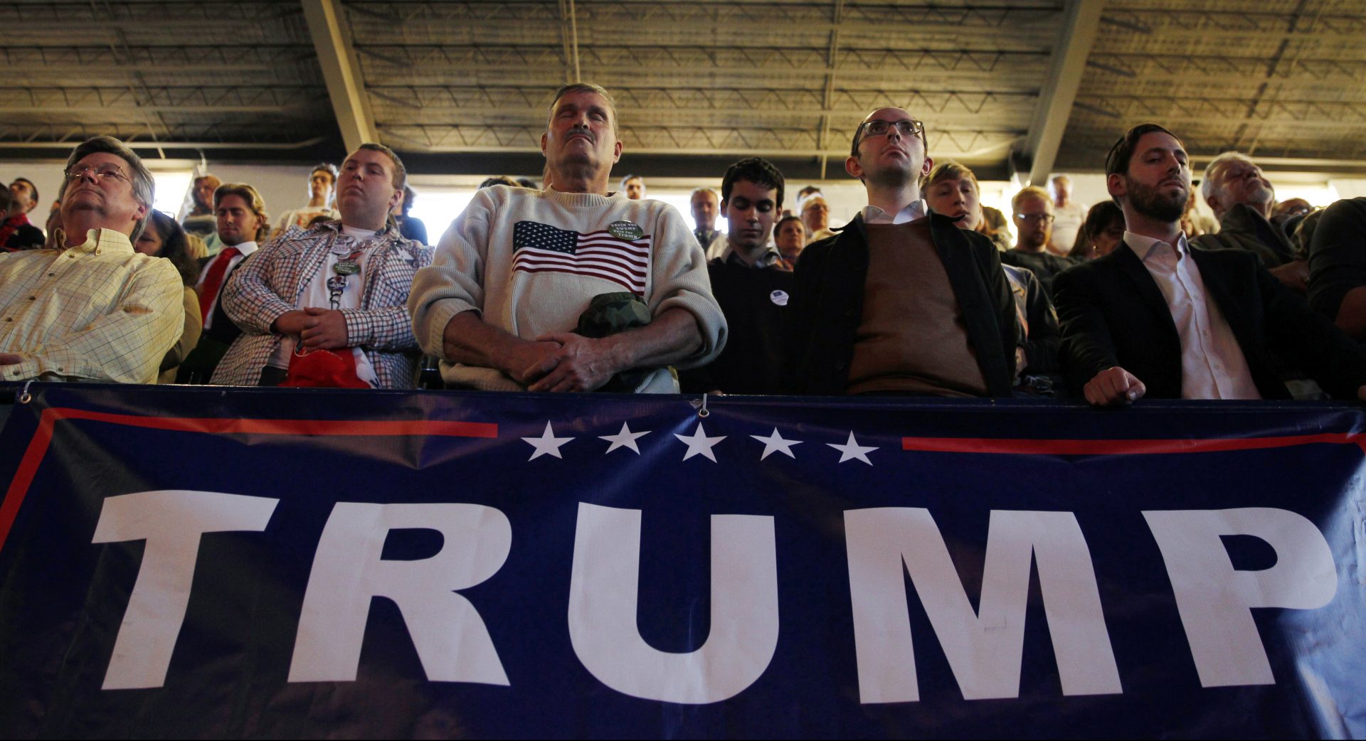 People pause in prayer during a campaign rally for Republican presidential candidate Donald Trump Nov. 7, 2016, in Scranton, Pa.