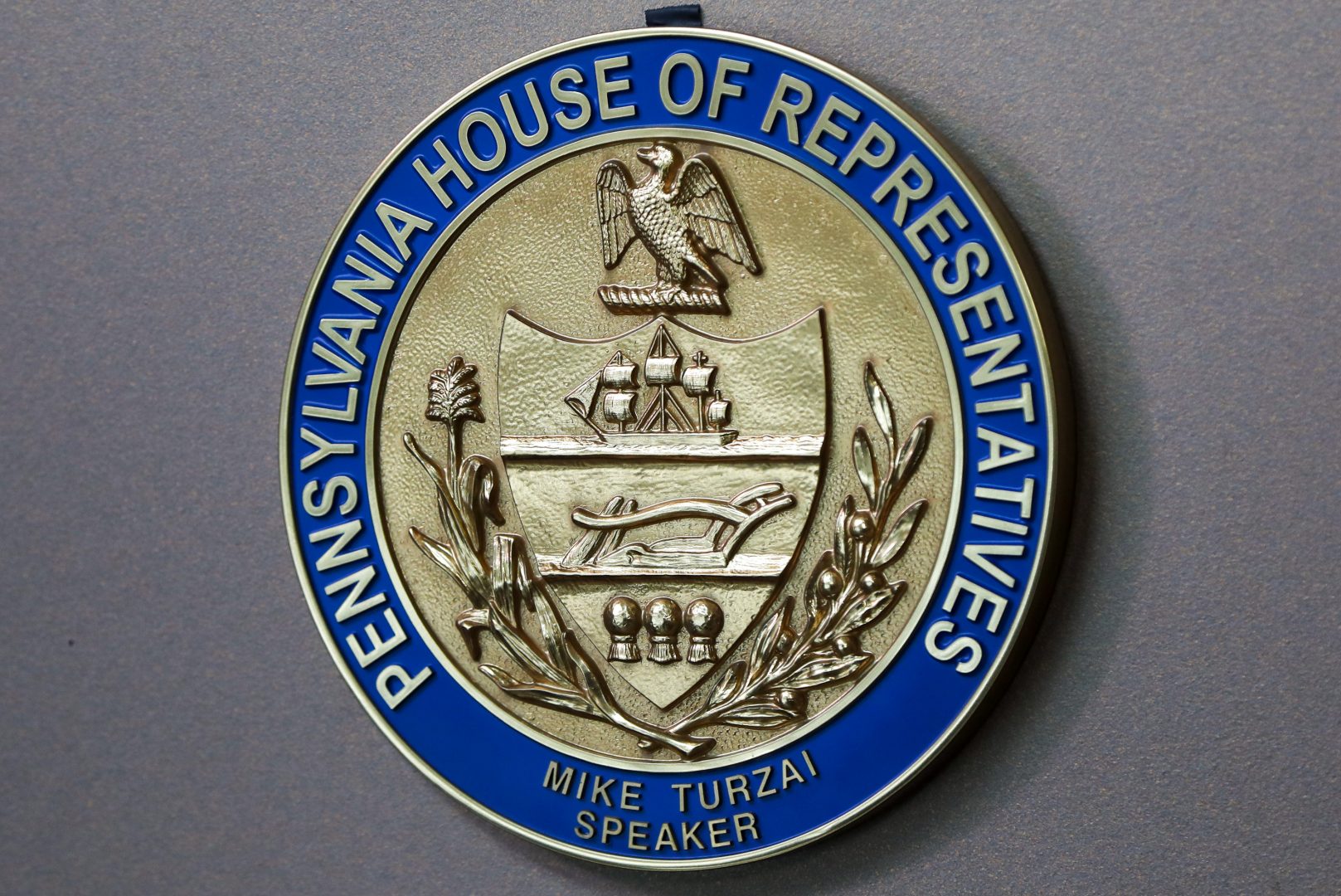 The emblem for Pennsylvania Speaker of the House, Mike Turzai, is on the wall at his offices as he announces at a news conference he will not run for another term as a Pennsylvania Representative, Thursday, Jan. 23, 2020, in McCandless, Pa. (AP Photo/Keith Srakocic)