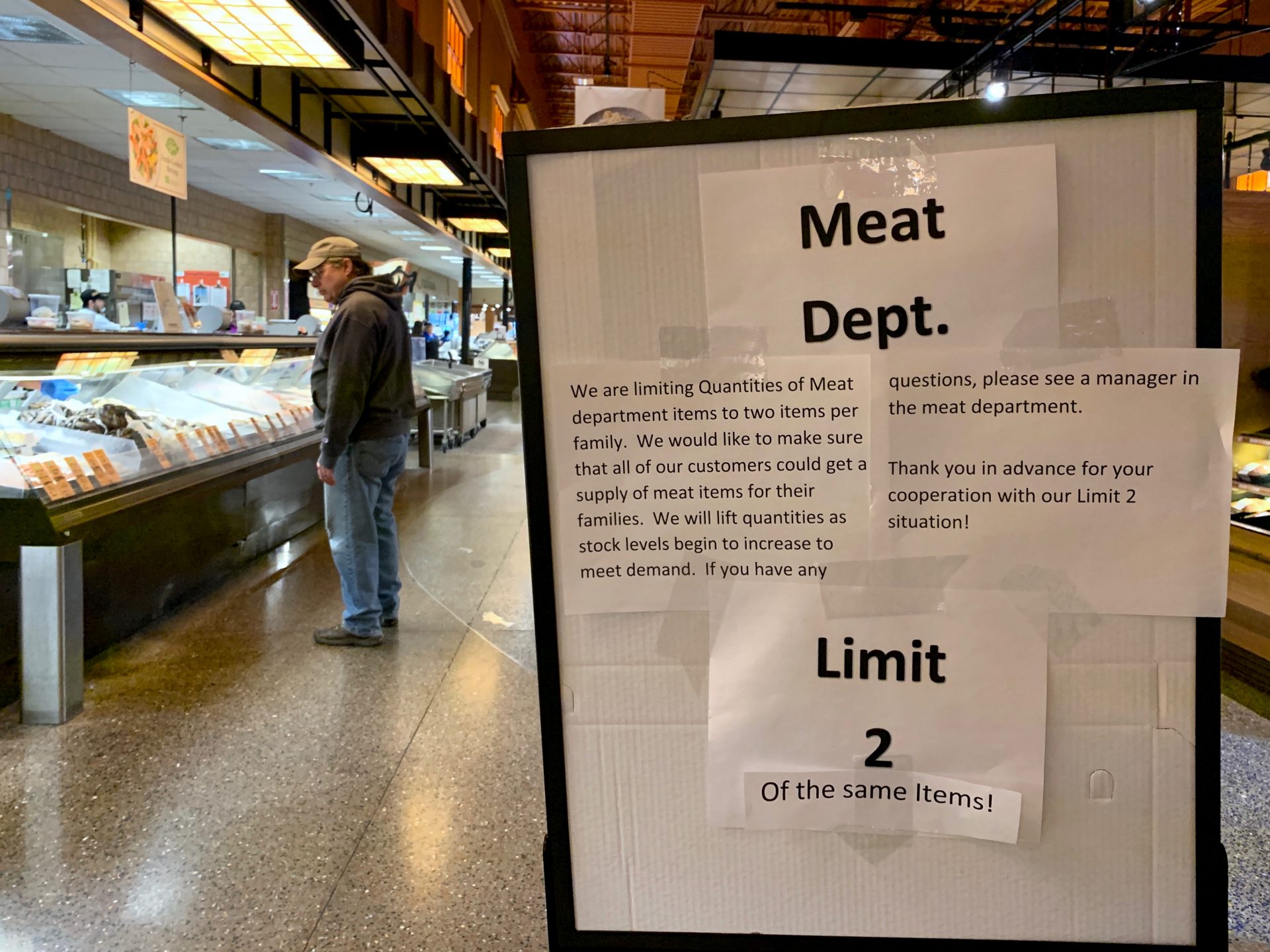A makeshift sign at Wegmans in Mechanicsburg, Pa., asks shoppers to limit their meat purchases to two of the same items on March 14, 2020. The first COVID-19 cases in the county were announced the day prior.
