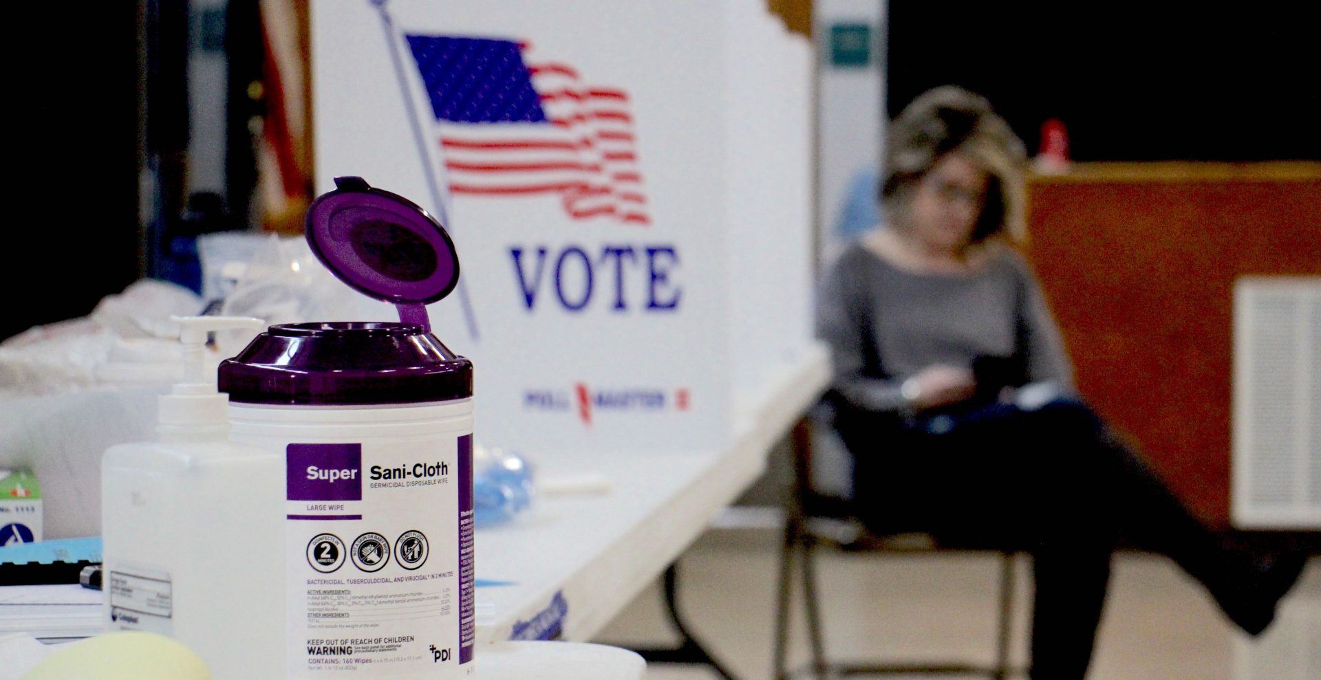Poll worker Dina Sebold waits for voters at Cecelia Snyder Middle School in Bensalem during a special election for a vacant seat in the Pennsylvania House of Representatives. Hand sanitizer and wipes were made available to voters, many of whom brought their own pens.