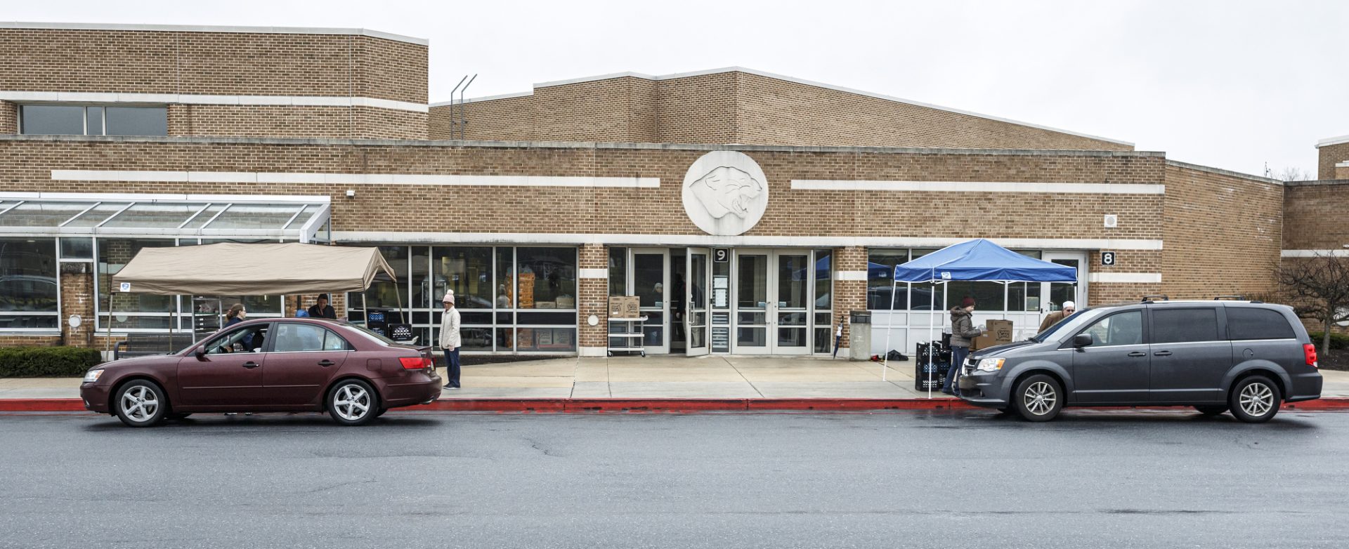 Vehicles arrive at Central Dauphin East High School. During the coronavirus COVID-19 shutdown, drive-through distribution of breakfast and lunch will be available each weekday from 8:30 a.m. through 11:00 a.m. at Central Dauphin East High School and Swatara Middle School. This first-come, first-served program is for all resident children in the district ages 18 and under, March 17, 2020.