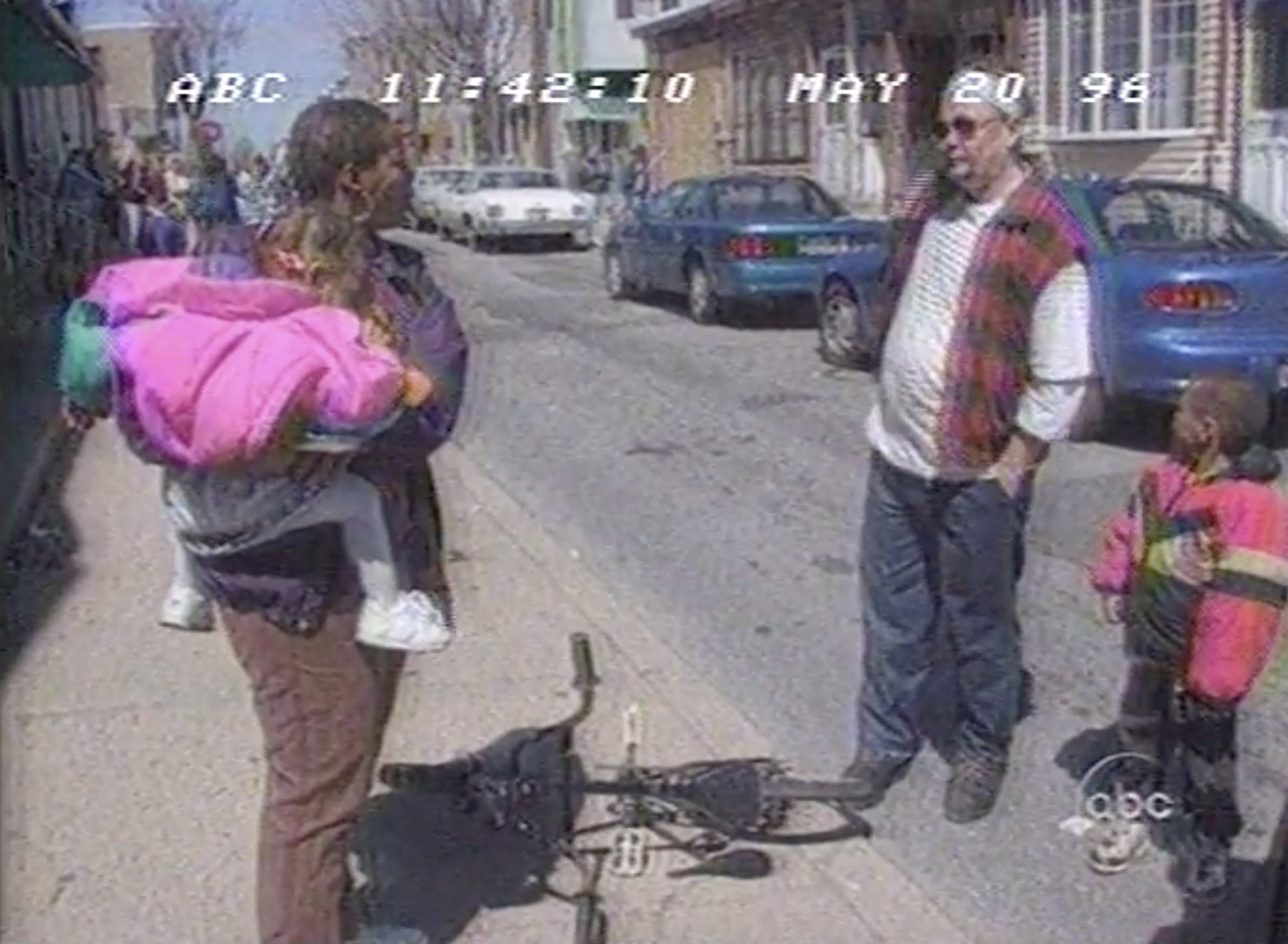 Bridesburg residents talking in the street amid a media circus during Nightline's 1996 feature.