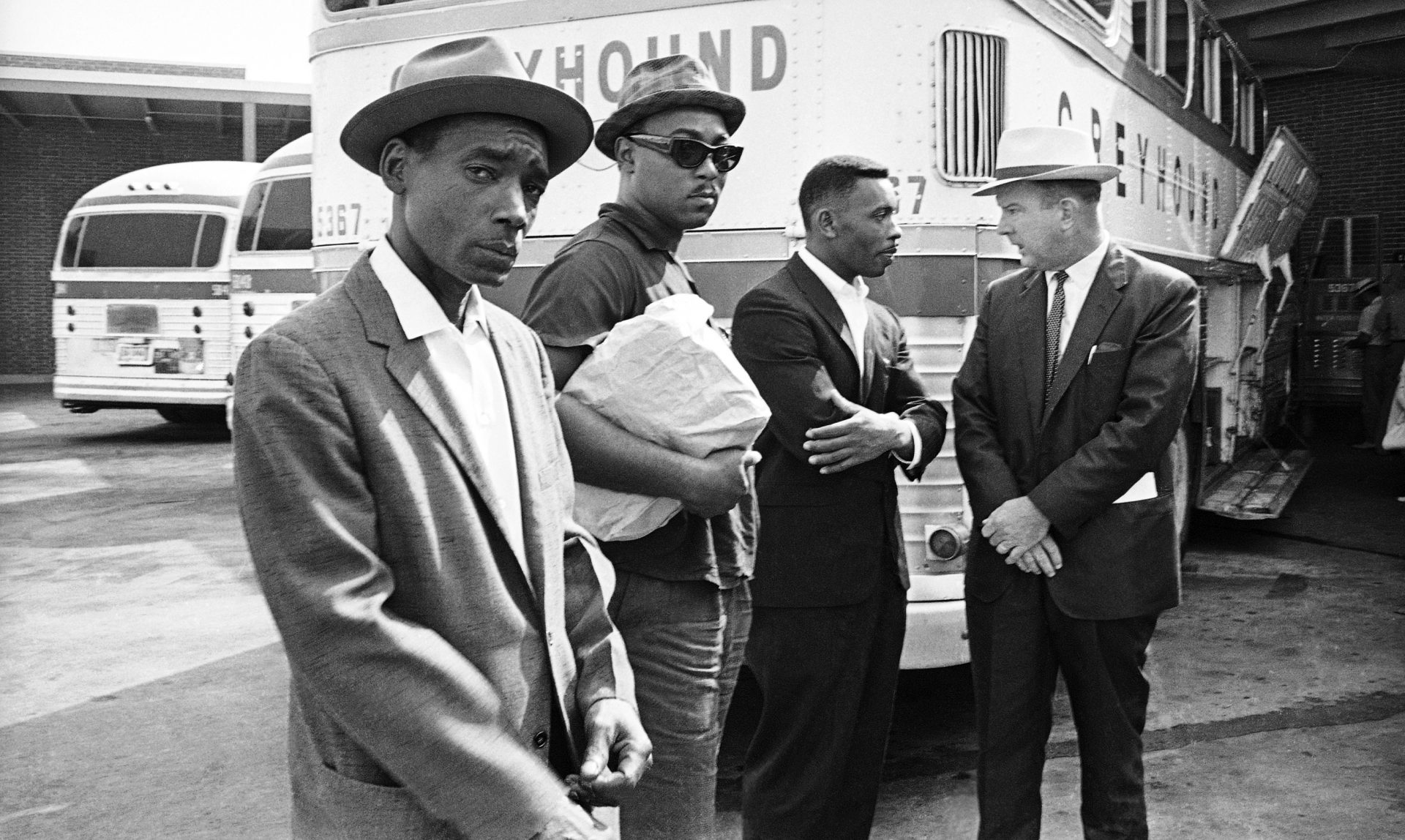 The Reverse Freedom Riders Eddie Rose, Almer Payton and Willie Ramsey are shown with Citizens Council director George Singlemann.