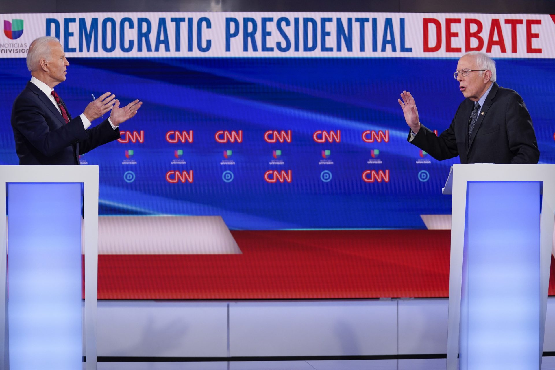 Former Vice President Joe Biden, left, and Sen. Bernie Sanders, I-Vt., right, participate in a Democratic presidential primary debate at CNN Studios in Washington, Sunday, March 15, 2020.