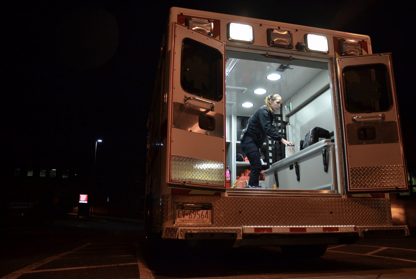 Emergency medical technician Justine Berry with Susquehanna Township EMS in Harrisburg, Pa., cleans an ambulance with antimicrobial wipes after a patient has been removed. EMS directors say more cleaning supplies and protective equipment will be vital if the coronavirus becomes widespread.