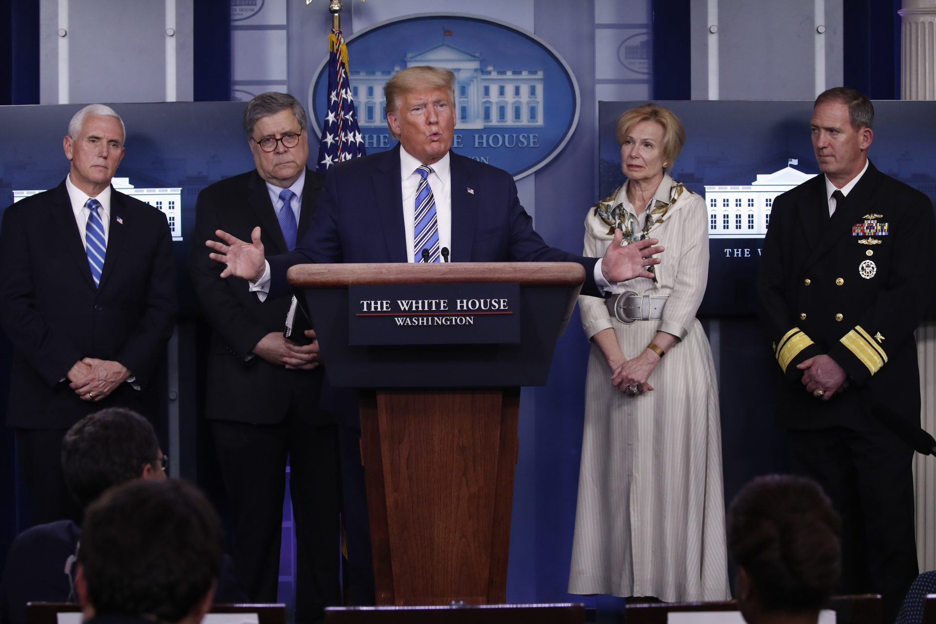 President Donald Trump takes questions from reporters as he speaks about the coronavirus in the James Brady Briefing Room, Monday, March 23, 2020, in Washington. Listens from left are Vice President Mike Pence, Attorney General William Barrm Dr. Deborah Birx, White House coronavirus response coordinator, and Navy Rear Adm. John Polowczyk, supply chain task force lead at FEMA,