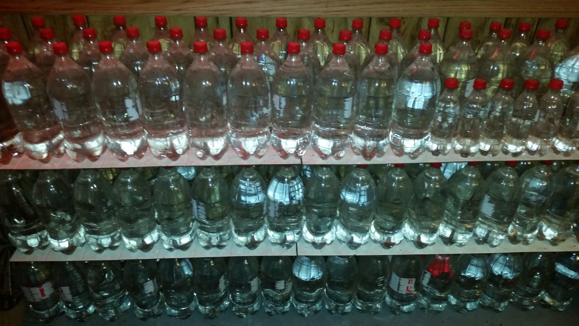 In this undated photo provided by Paul Buescher, water is stored in stacks of 2-liter bottles in a barn near Garrettsville, Ohio. The water can be used by 32 members of a group in northeastern Ohio that shares a farm packed with enough canned and dehydrated food and water to last for years. For those in the often-mocked "prepper" community, this is quickly becoming their "I told you so" moment, as panic buying has cleared store shelves across the U.S. amid growing fears that the new coronavirus will force many Americans to self-quarantine for weeks in their homes.