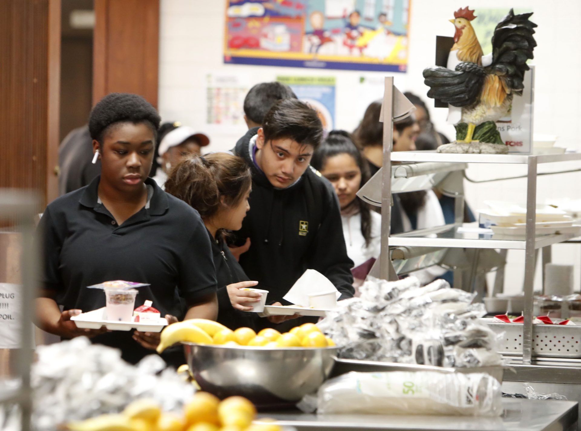 Students line up for lunch in the cafeteria at Lincoln High School in Dallas, Friday, March 13, 2020. During the coming extended spring break school closures, this cafeteria and others in the Dallas Independent School District will be providing lunches to students despite the closure of the school.