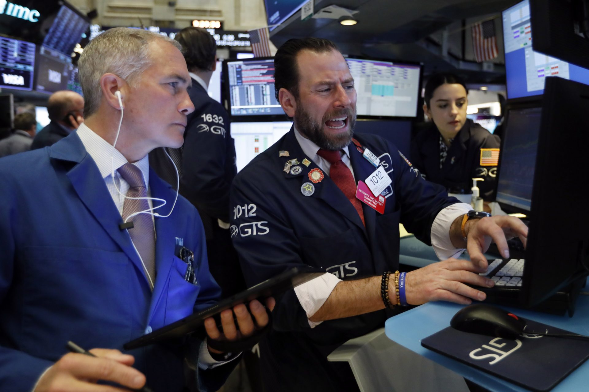 Trader Timothy Nick, left, and specialist Michael Pistillo work on the floor of the New York Stock Exchange, Tuesday, March 3, 2020. Stocks are opening lower on Wall Street after the Group of Seven countries held off on giving the global economy new stimulus to help it cope with the coronavirus outbreak.