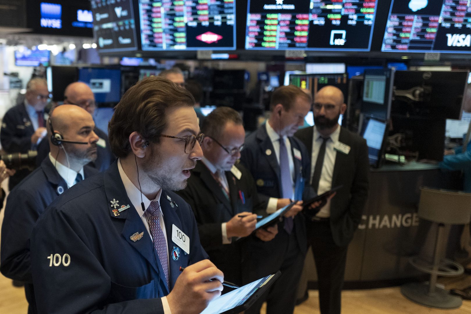 Traders work at the New York Stock Exchange, Wednesday, March 18, 2020. Global stock markets have sunk in a third day of wild price swings after President Donald Trump promised to prop up the U.S. economy through the coronavirus outbreak.