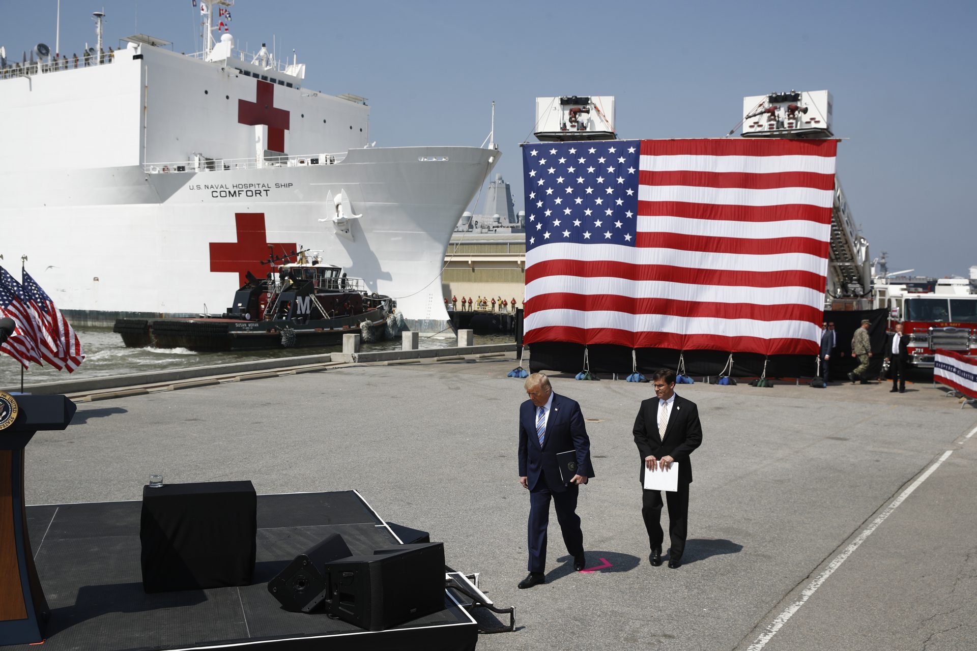 President Donald Trump and Defense Secretary Mark Esper arrive to speak in front of the U.S. Navy hospital ship USNS Comfort at Naval Station Norfolk in Norfolk, Va., Saturday, March 28, 2020. The ship is departing for New York to assist hospitals responding to the coronavirus outbreak.