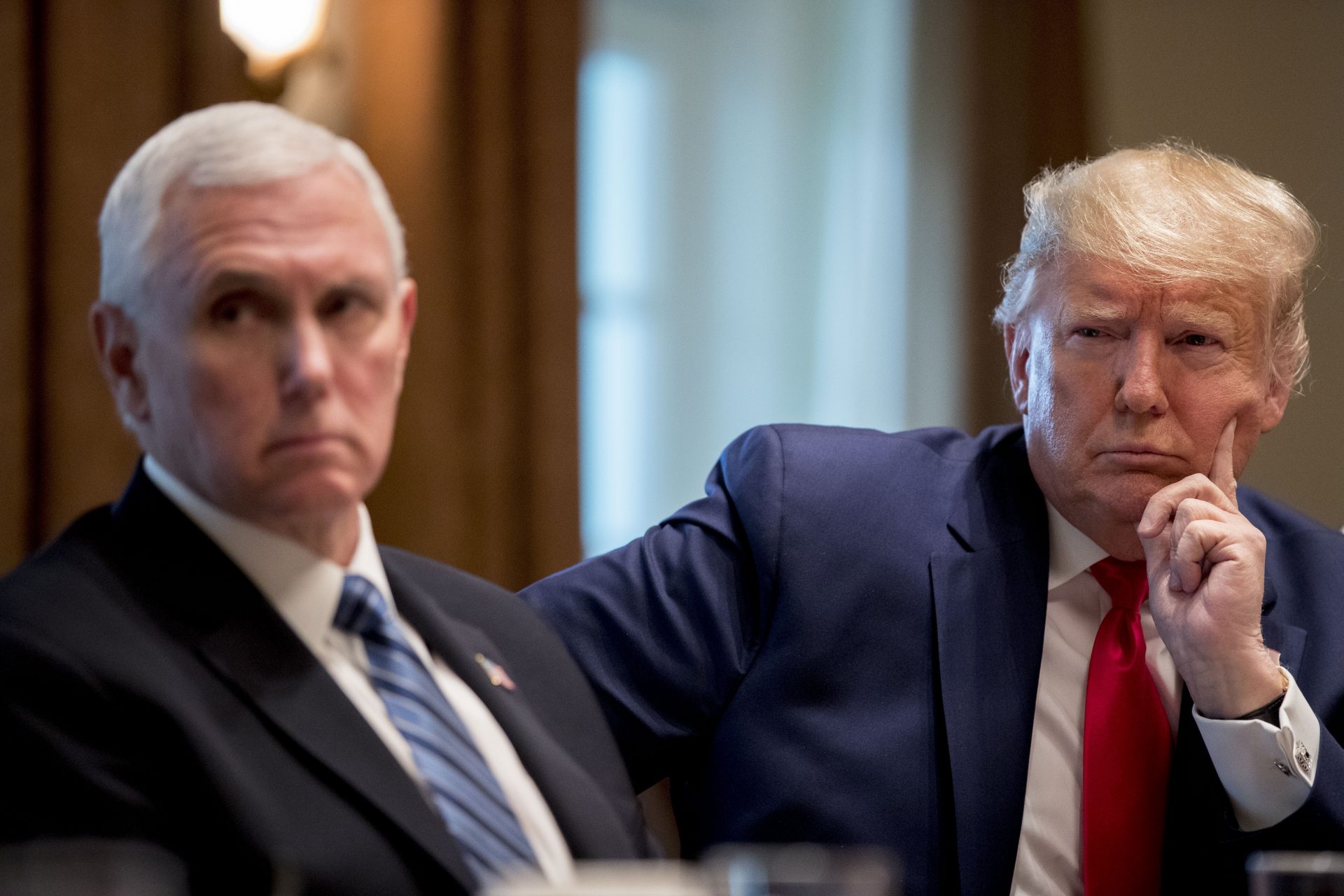 President Donald Trump and Vice President Mike Pence meet with pharmaceutical executives in the Cabinet Room of the White House, Monday, March 2, 2020, in Washington.