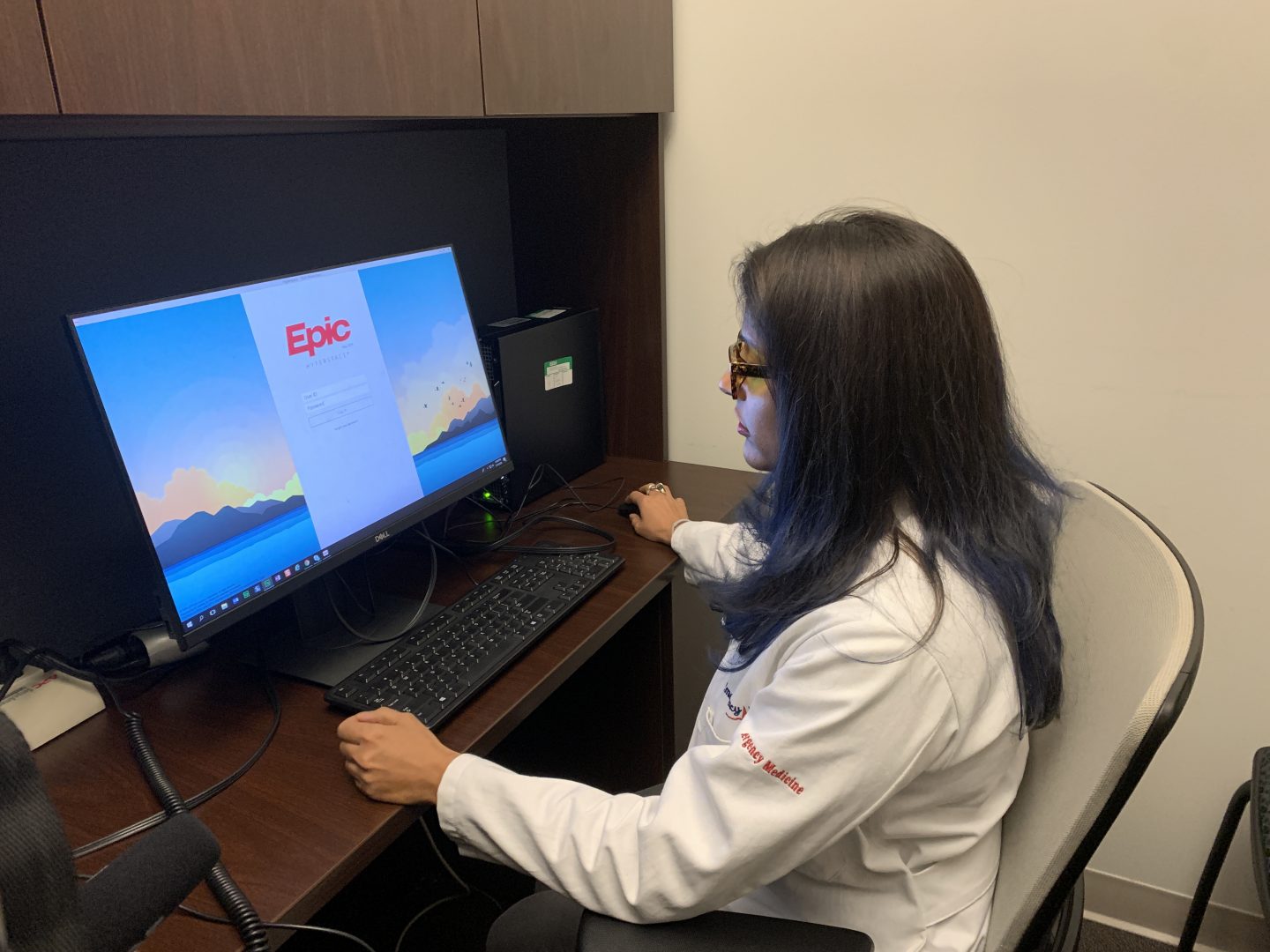 Dr. Aditi Joshi, director of JeffConnect, Thomas Jefferson University Hospital’s telehealth platform, opens EPIC, the hospital's electronic medical records program. That way she can look up at patient's history and see scans and other test results before meeting with them virtually.