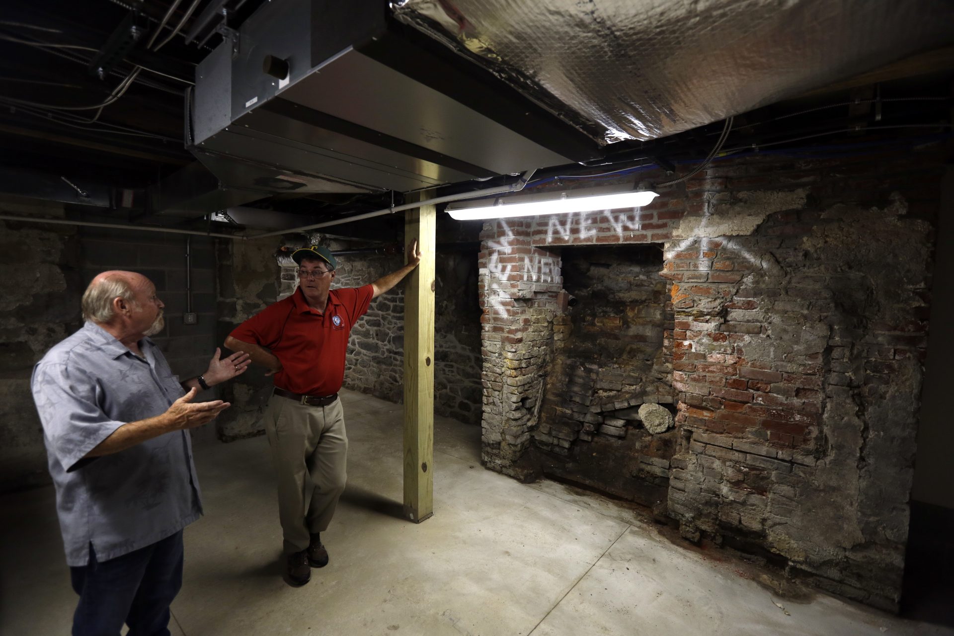 Tinicum's building official Herbert MacCombie, left, speaks with Tinicum township board president Patrick McCarthy in the lowest level of the refurbished Lazaretto Quarantine Station Wednesday July 10, 2019, in Essington, Pa. For Tinicum Township, renovating The Lazaretto was a way to embrace history and part of a broader plan to bring visitors to the community. For historians, saving the Lazaretto offers a chance to tell the story of immigration, epidemics and public health in America's early days. Built in 1799, the quarantine station protected the Port of Philadelphia against the introduction of epidemic disease for nearly a century.