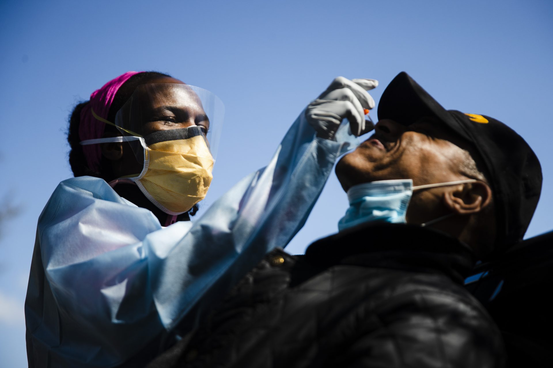 Dr. Ala Stanford administers a COVID-19 swab test on Wade Jeffries in the parking lot of Pinn Memorial Baptist Church in Philadelphia, Wednesday, April 22, 2020. Stanford and other doctors formed the Black Doctors COVID-19 Consortium to offer testing and help address heath disparities in the African American community.