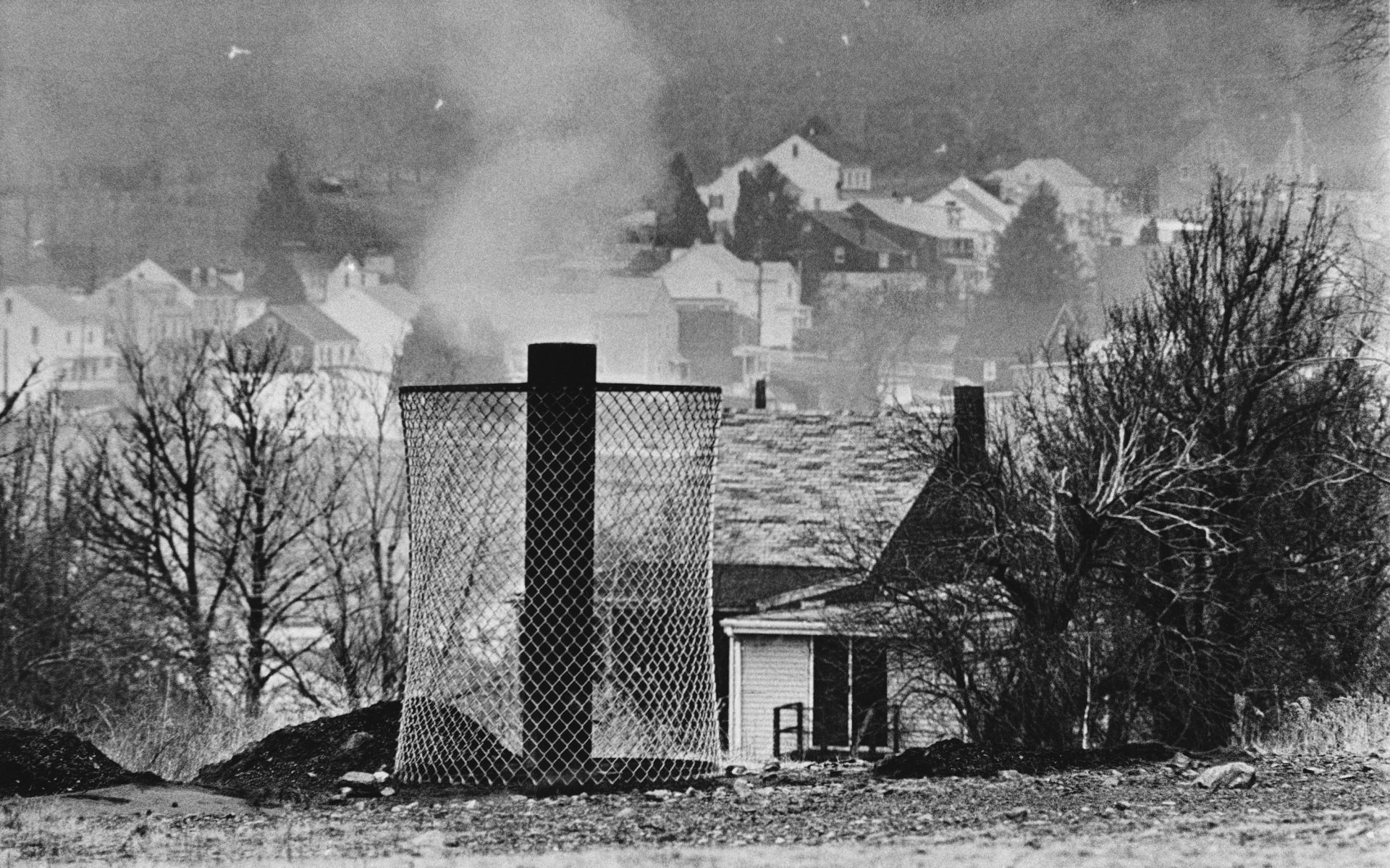 Smoke rises from the ground in this general view of Centralia, Pennsylvania on Jan. 26, 1983 where an uncontrolled, 20-year-old underground mine fire is raging. A resident of the town says: "It's hell on earth."