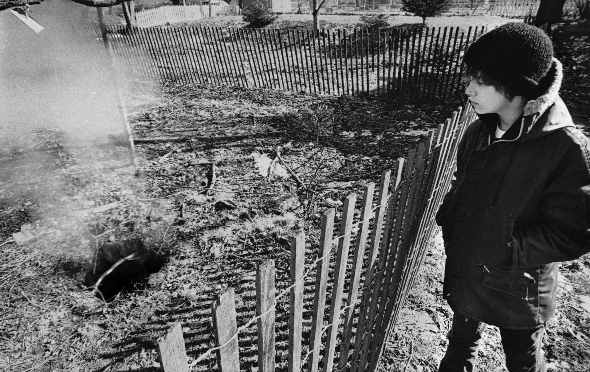 Todd Domboski, 12, of Centralia, Pennsylvania, looks over a police barricade at the hole he fell through just hours before photo was taken on Feb. 14, 1981 in Centralia. The hole was caused by a mine fire that's been burning since 1962.