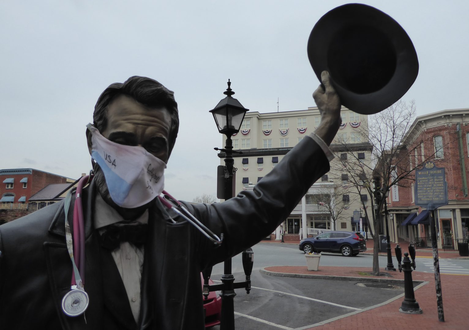 A statue of Abraham Lincoln outside the Wills House in Gettysburg, Pa. sports a sign of the times during the coronavirus pandemic Monday, April 20, 2020. Gov. Tom Wolf recommended that all Pennsylvanians wear masks when they go out.