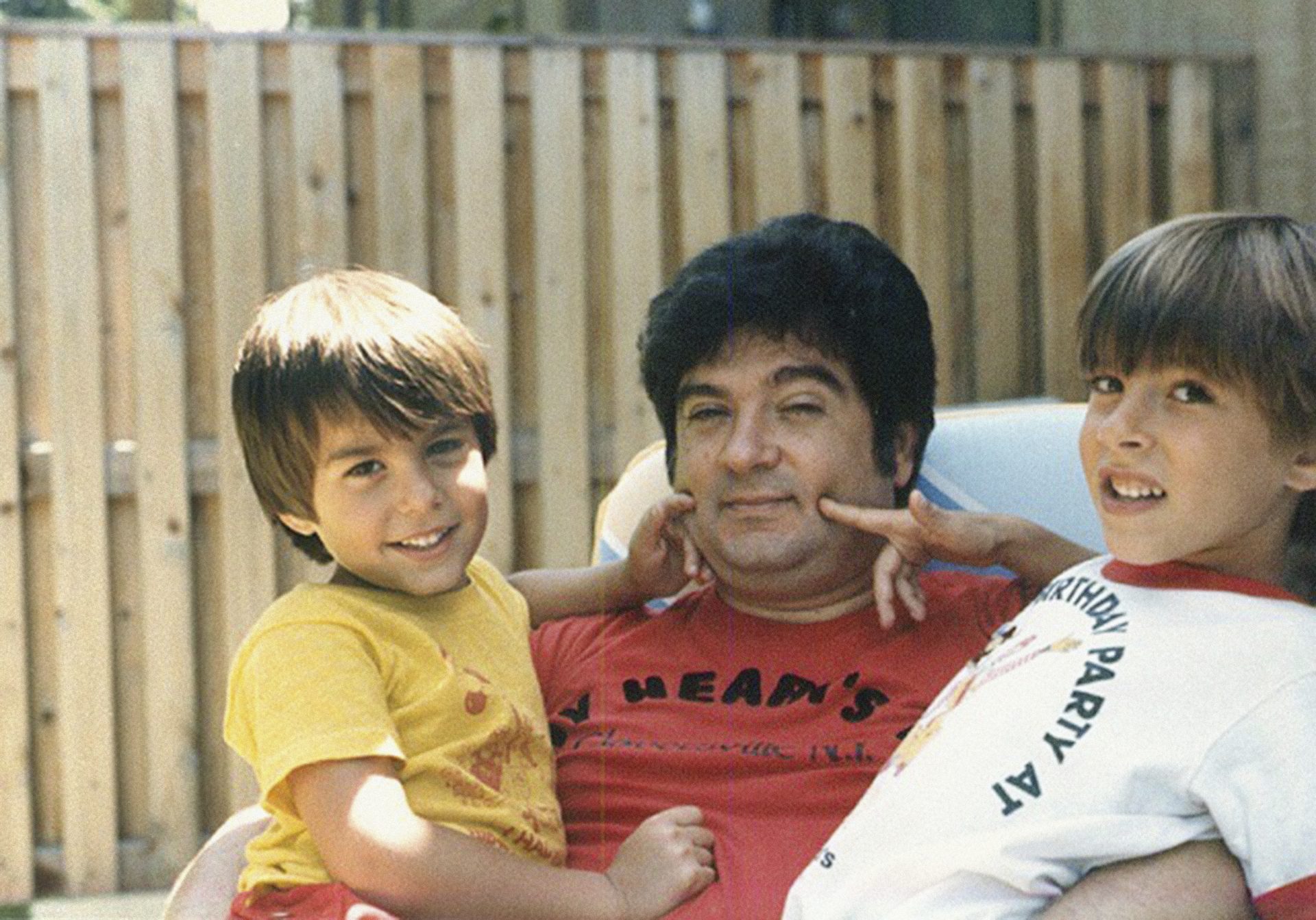 This circa 1987 photo provided by the family shows Isaiah Kuperstein with his sons, Daniel, left, and Adam in the Queens borough of New York. Isaiah Kuperstein died from COVID-19 on April 4, 2020. He was 70.