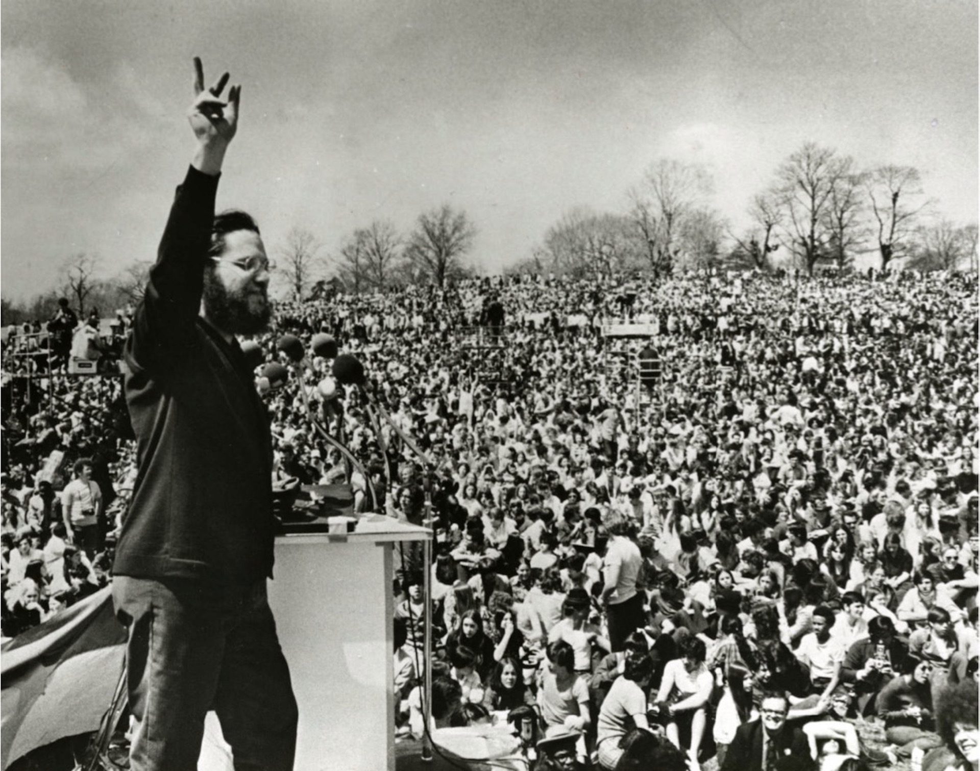 Master of ceremonies Ira Einhorn welcomes early arrivals to the Earth Day rally on Belmont Plateau in Philadelphia.