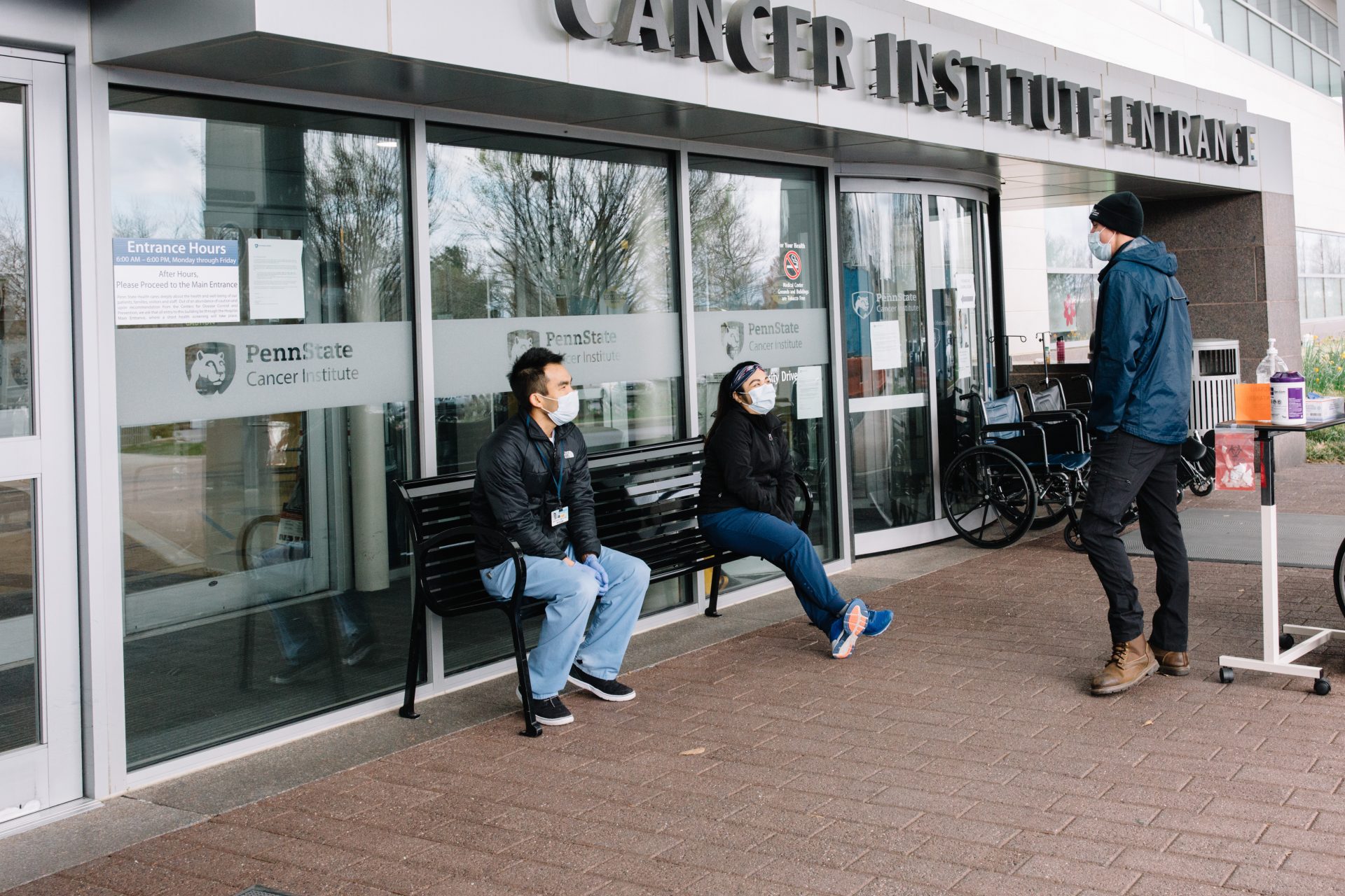 People wait outside Penn State Health's Milton S. Hershey Medical Center on April 10, 2020.