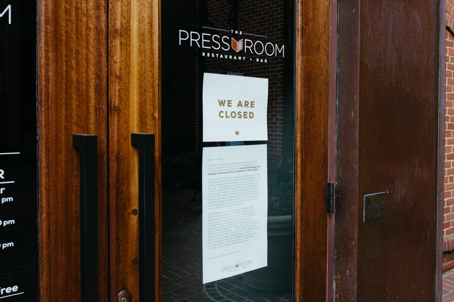 A sign is posted on the door of the closed Press Room Restaurant and Bar in Lancaster on April 19, 2020.