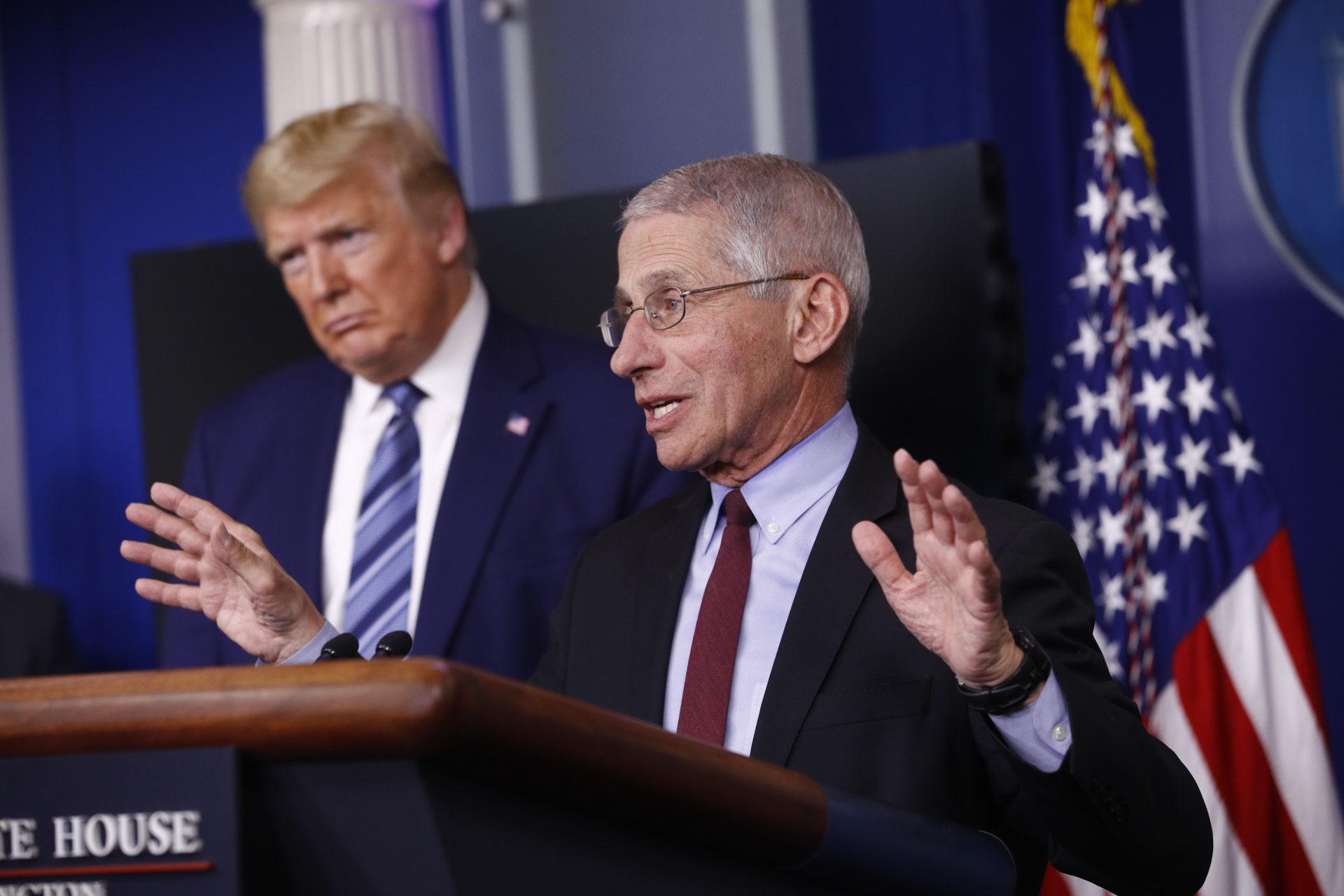 President Donald Trump listens as Director of the National Institute of Allergy and Infectious Diseases Dr. Anthony Fauci speaks during a coronavirus task force briefing at the White House, Sunday, April 5, 2020, in Washington.
