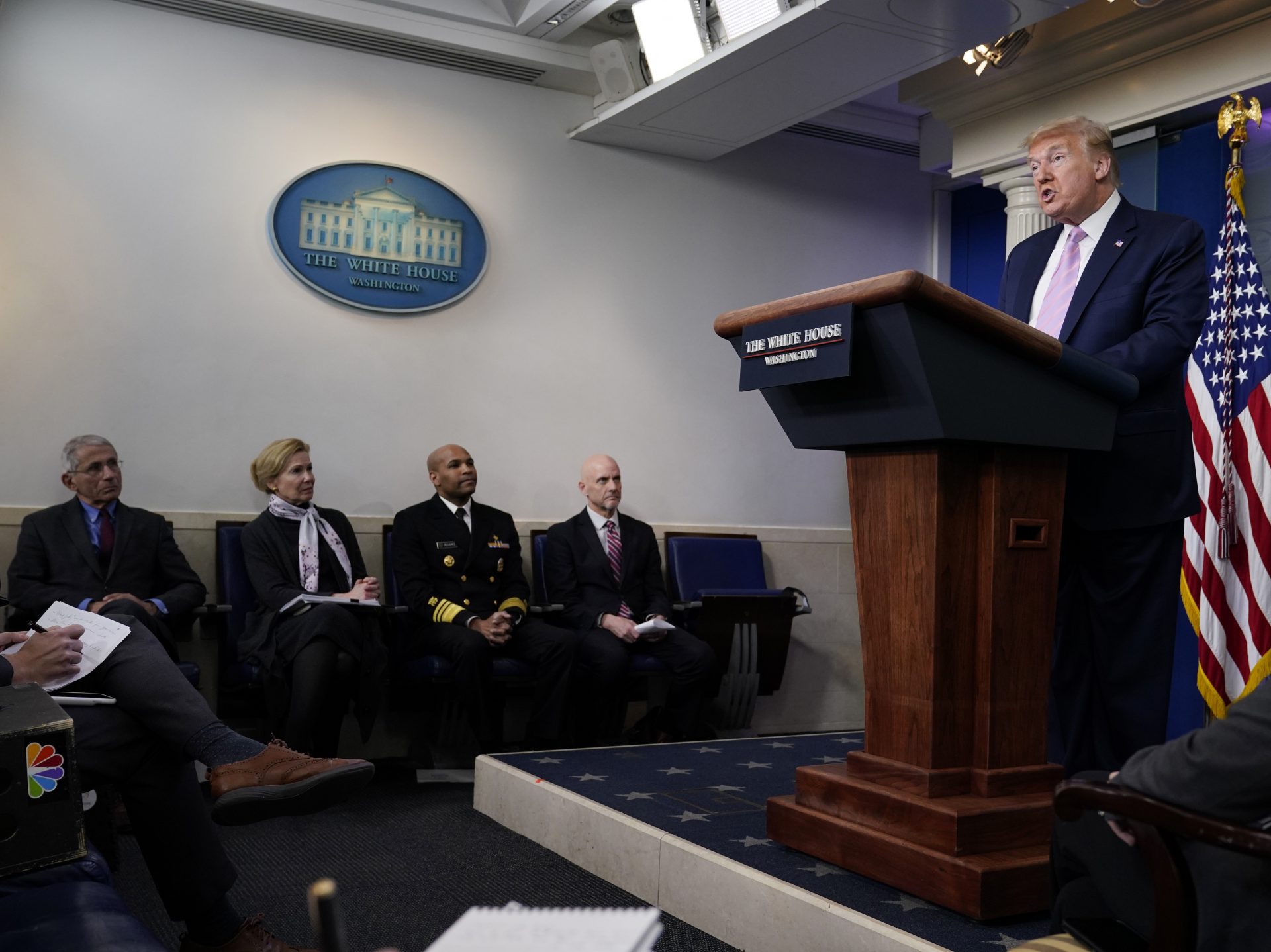 President Donald Trump speaks during a coronavirus task force briefing at the White Houseon Friday. Seated from left, Director of the National Institute of Allergy and Infectious Diseases Dr. Anthony Fauci, White House coronavirus response coordinator Dr. Deborah Birx, Surgeon General Jerome Adams, and Food and Drug Administration Commissioner Dr. Stephen Hahn.